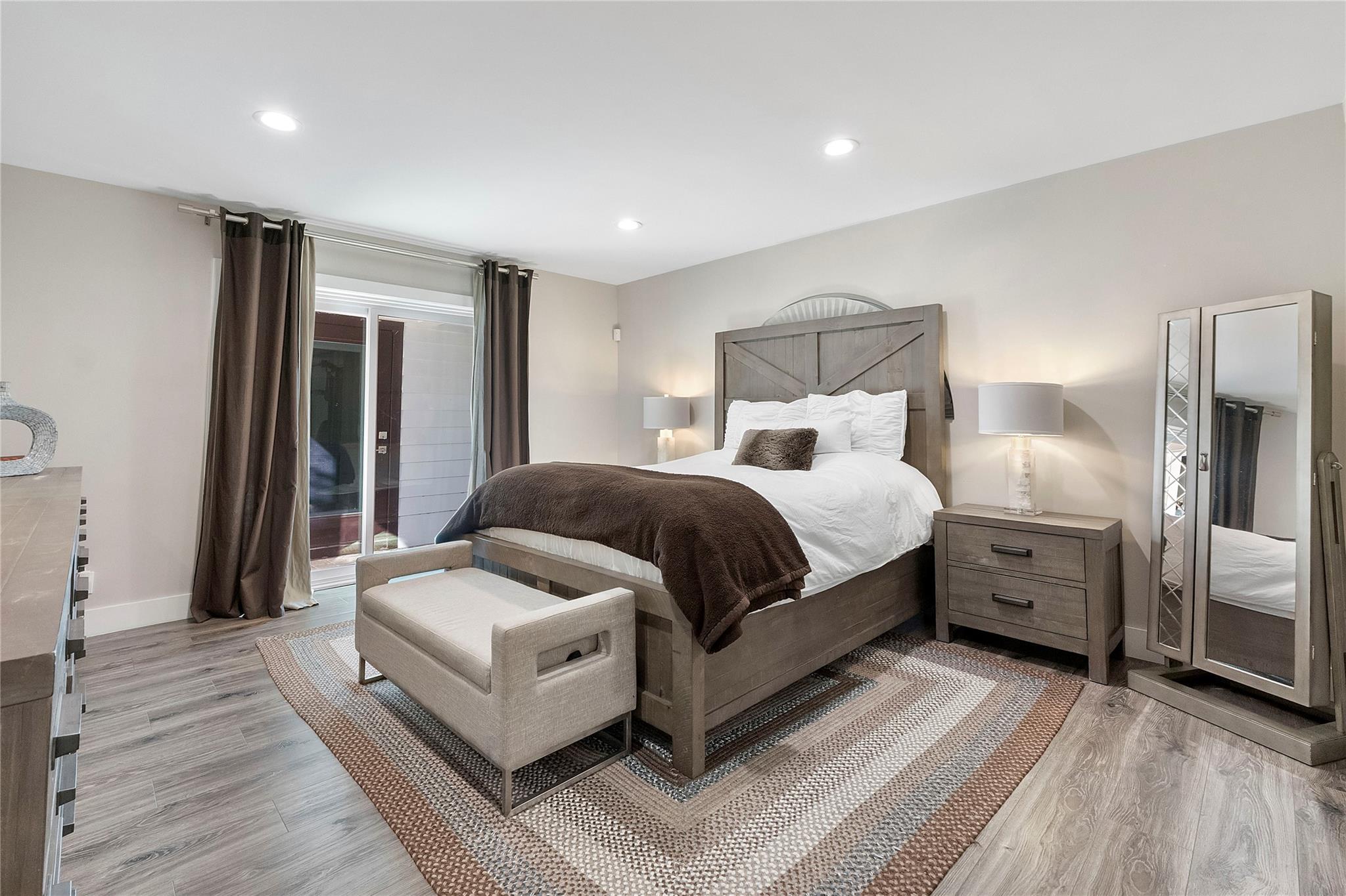 The Primary bedroom with ample space for a King bed, 2 nightstands and then some