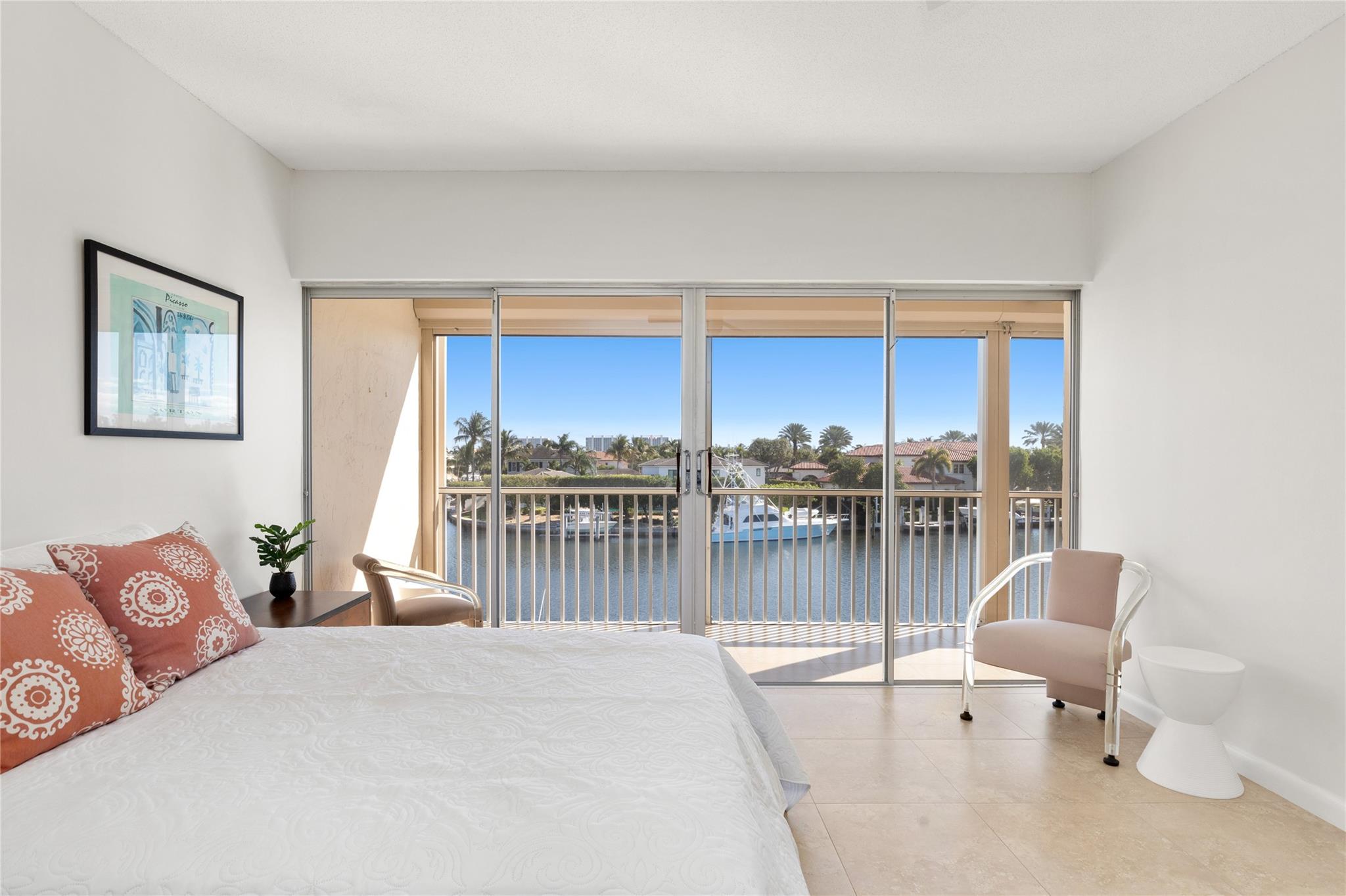 Primary bedroom with balcony access.