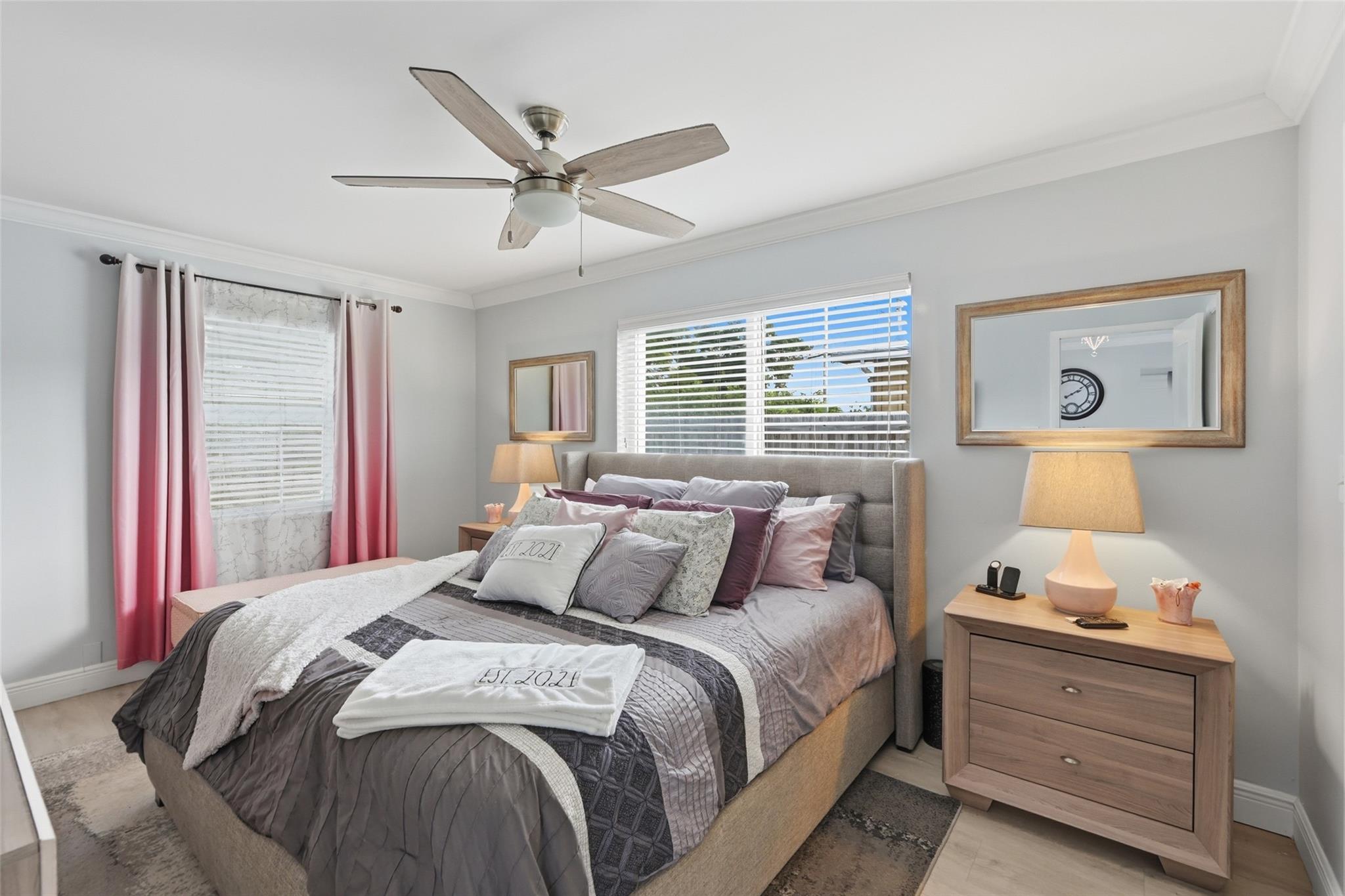 Large primary bedroom located in the back of the house. Plenty of natural light. The is even a sitting area in your bedroom.