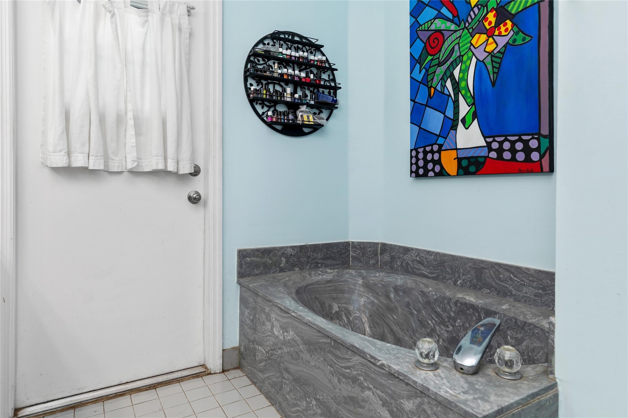 Soaking Roman tub and access directly to pool