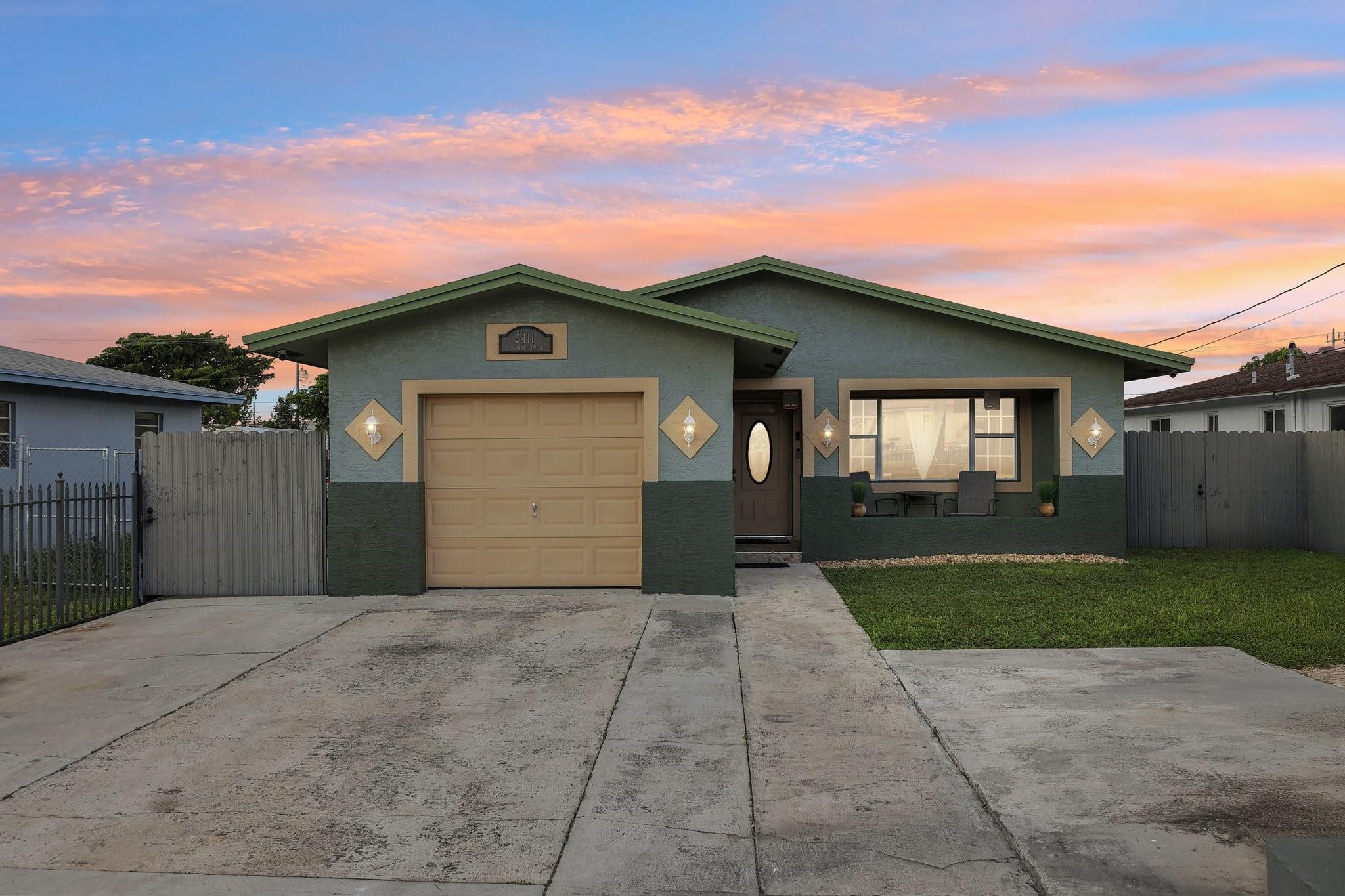 Photo for 5411 SW 19th Street, West Park, FL 33023 - listing #FX-10531643 Step into this inviting home with a spacious, wide front yard that provides a sense of openness and curb appeal.