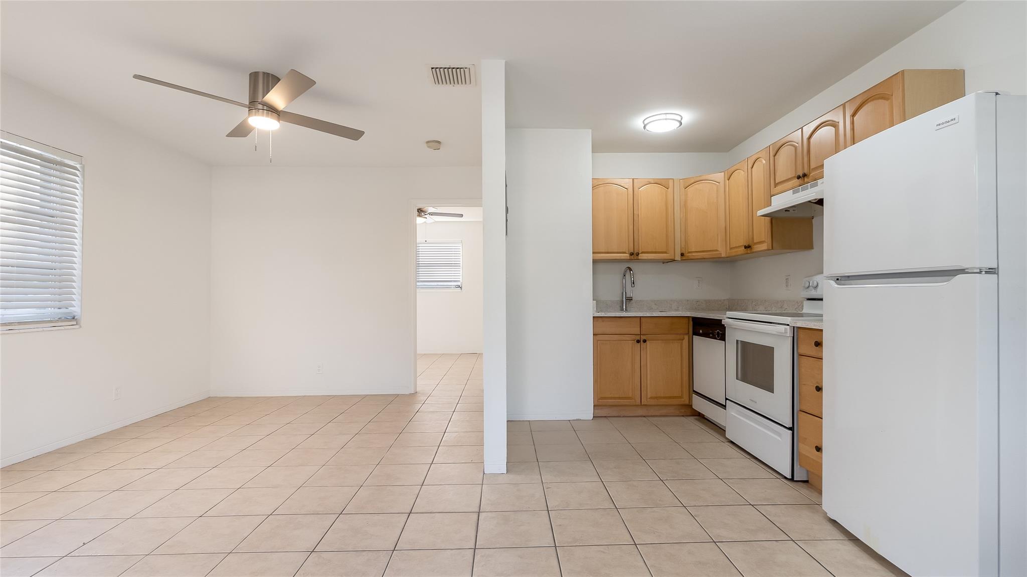 Eat in kitchen opens to spacious and bright family room