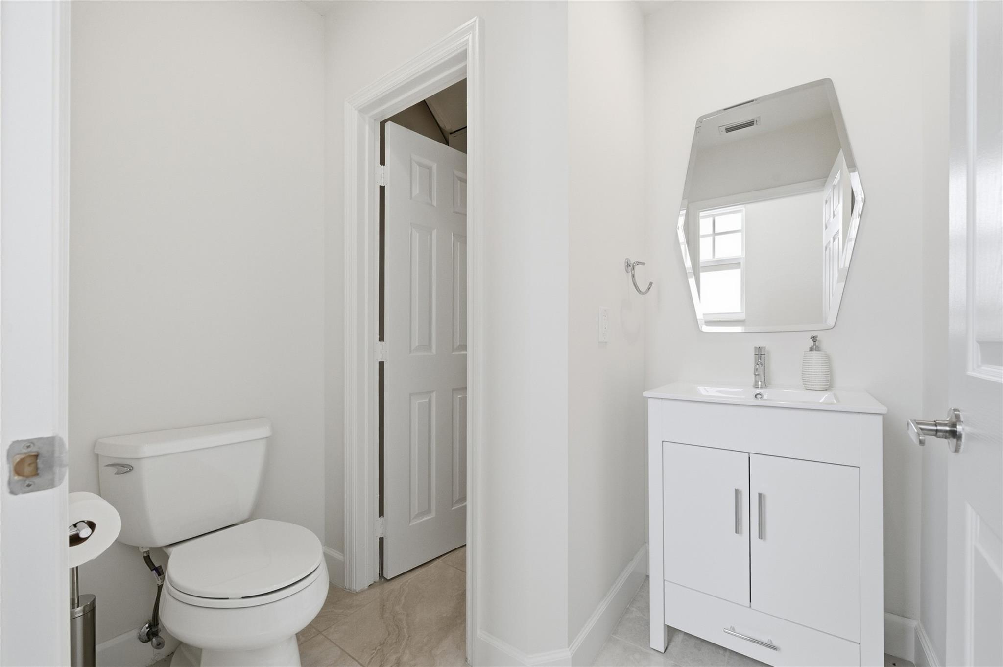 Ground Floor 1/2 bath with under stair storage/pantry