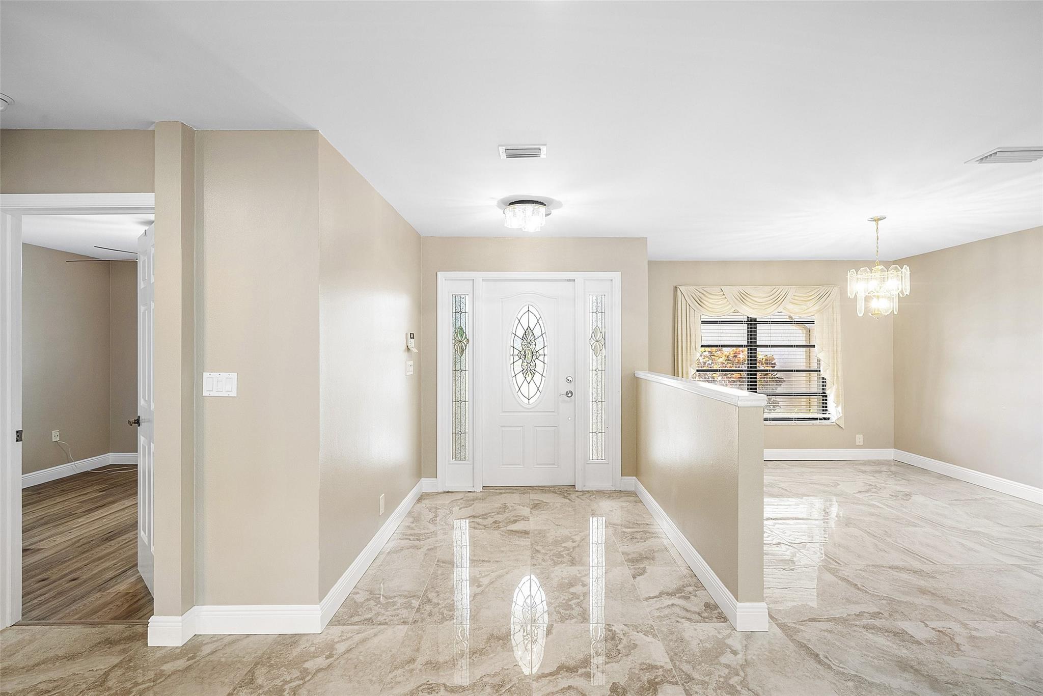 Front foyers and dining rooms space-can accommodate larger dining table and chairs.