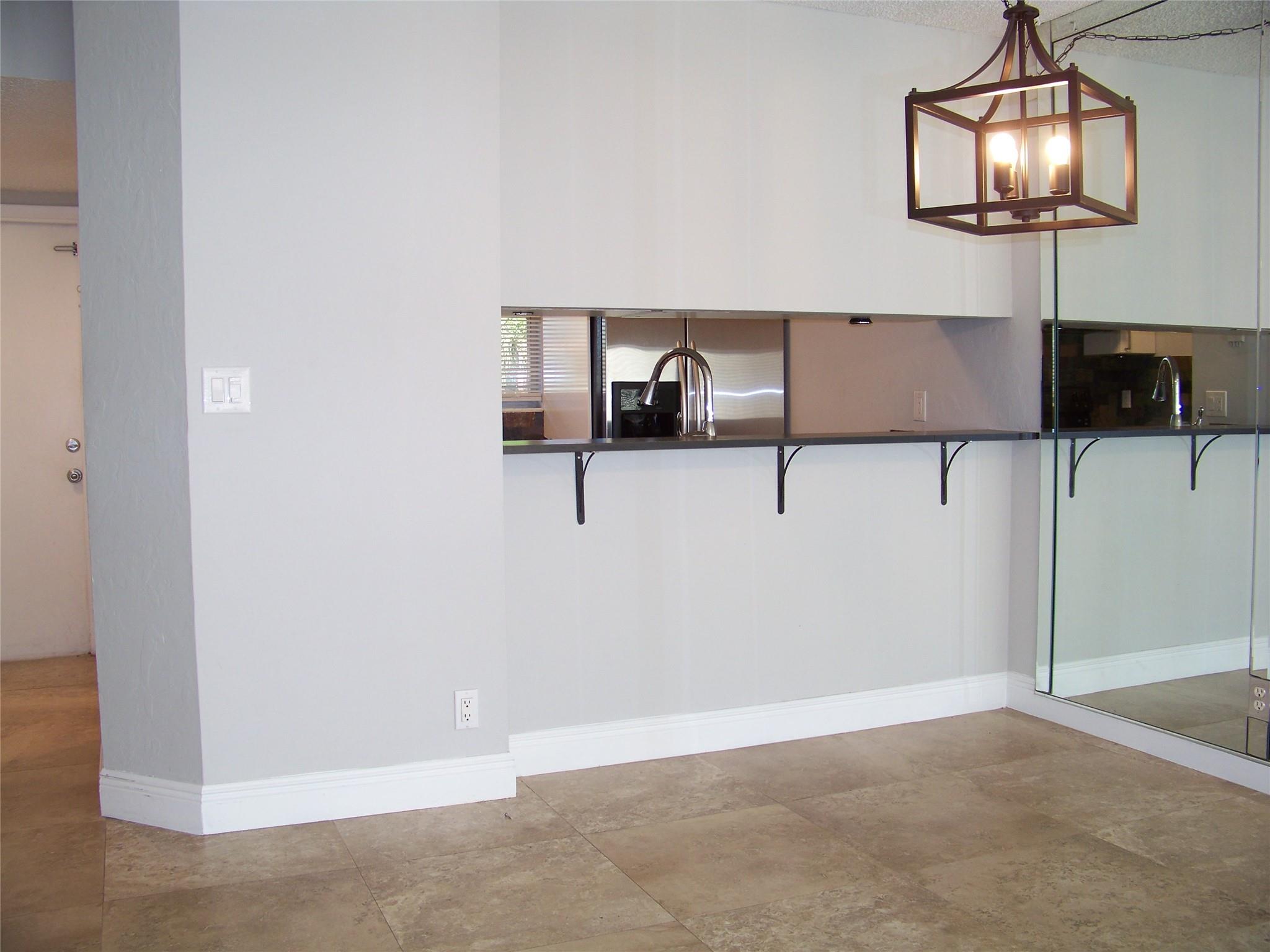 Dining area and kitchen pass-through from family room