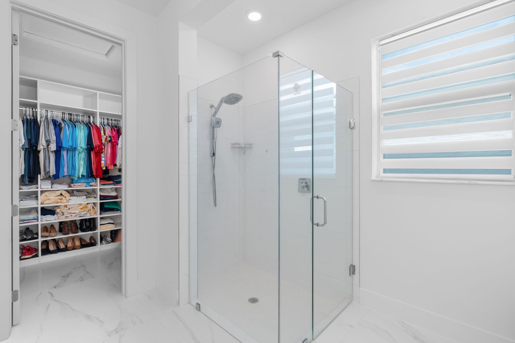 Large Frameless Shower with Oversized Window for Natural Light