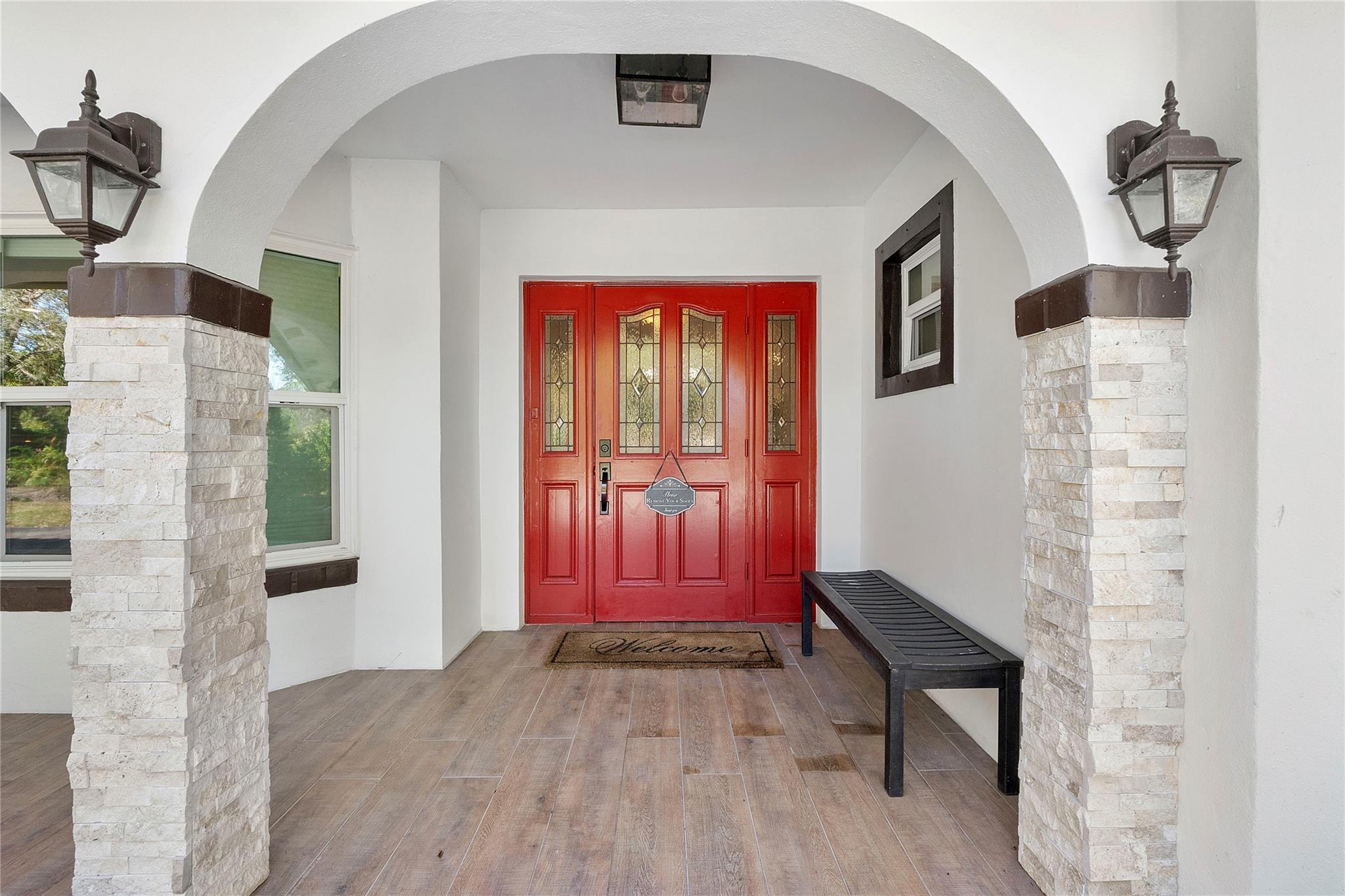 Timeless modern Grand Entry, The front door is hurricane impact as well as all the windows & doors, Stylish Stone accent pillars to compliment the entryway,