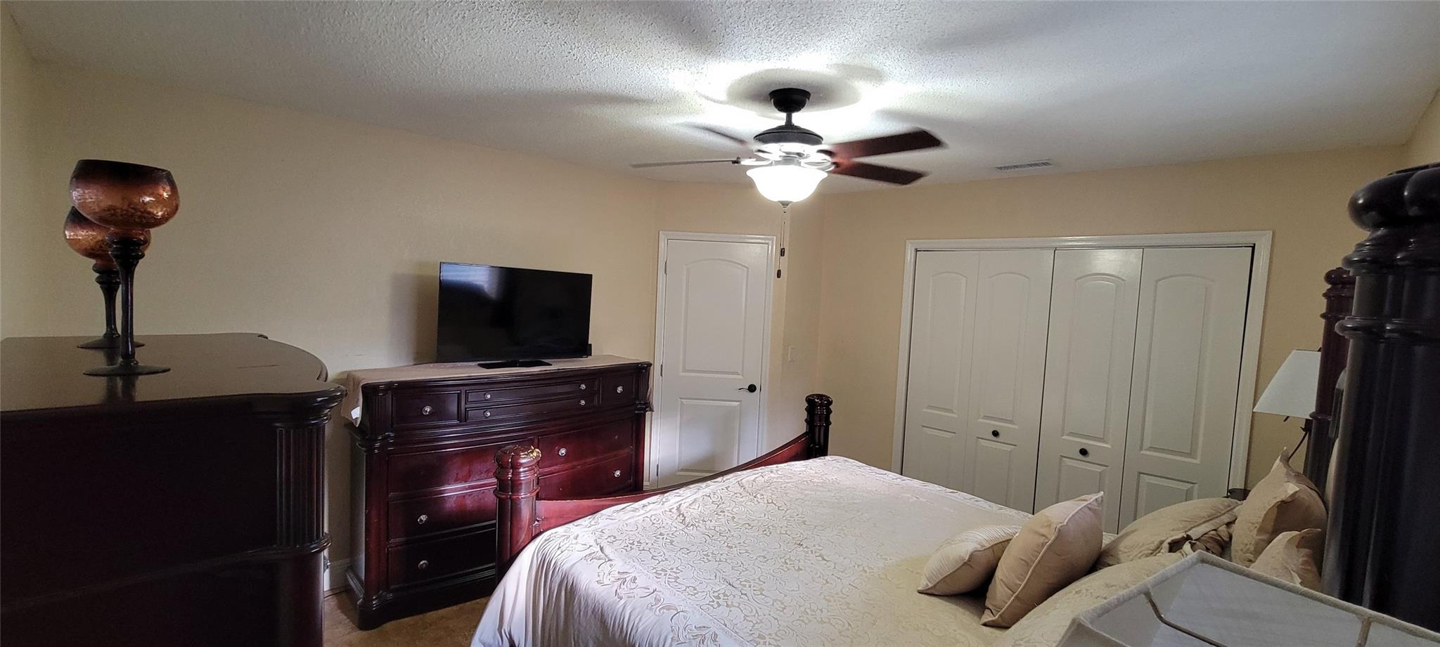 Comfortably sized bedroom with ample natural light.