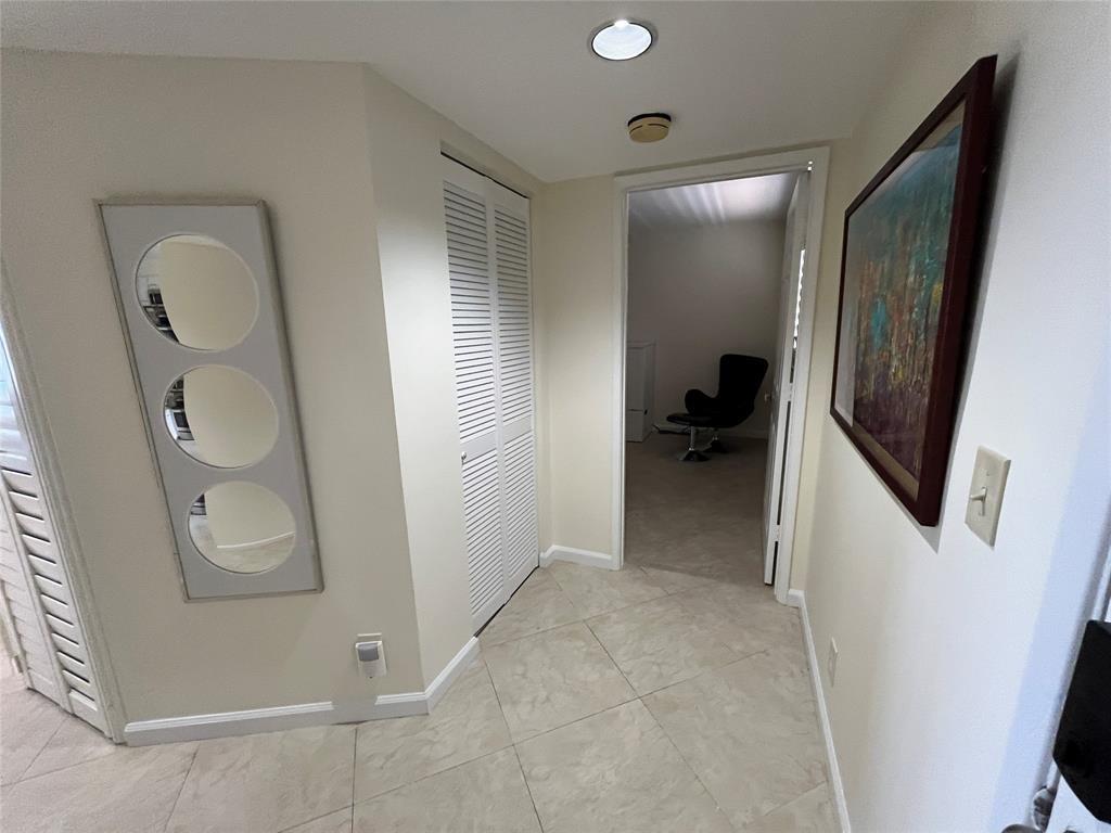 Front entryway showing entrance into second bedroom.