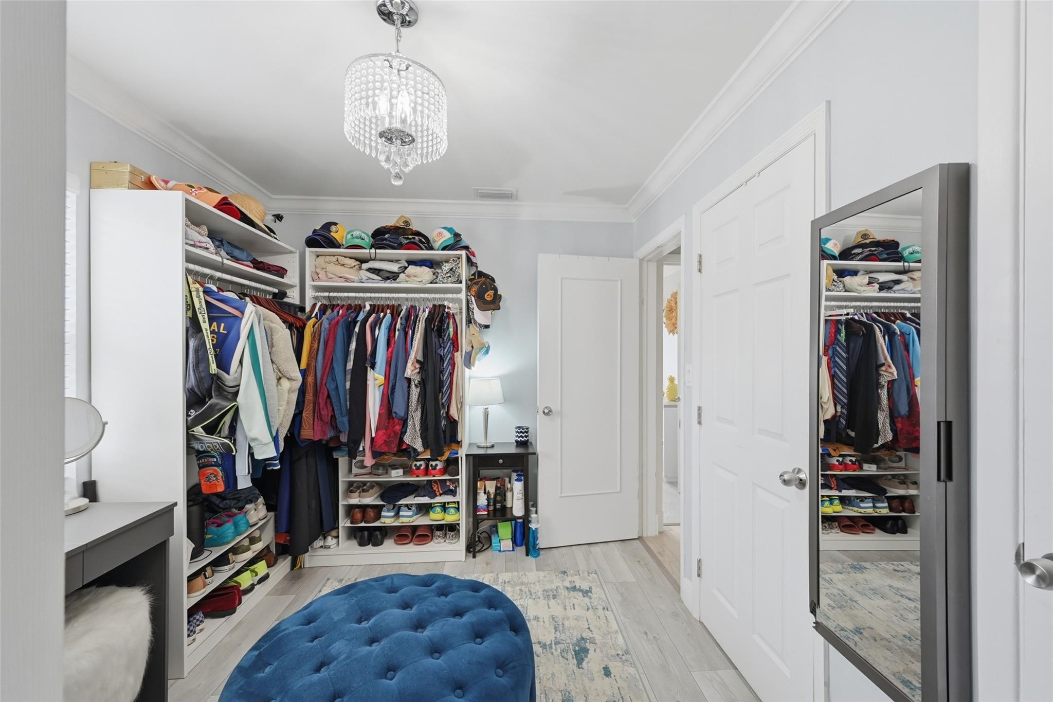 This room is currently being used an oversized closet but it is a 4th bedroom if you wanted it.