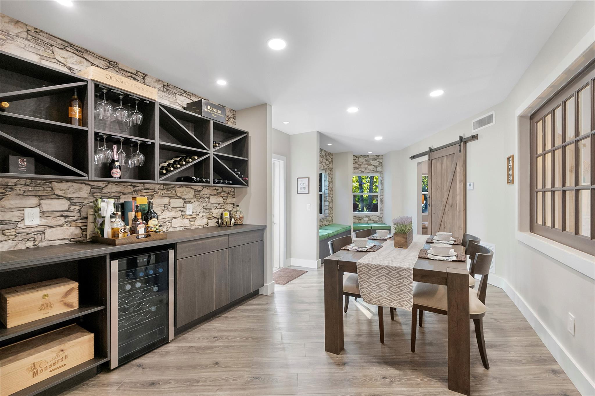 This is a very pretty room that leads off of the kitchen and living open floor plan area, You could use it as one of the many dining areas or an extra open room for teens to play video games or just hang out with friends, This room lead to another private room in the back with a huge barn door and a matching accent wall inside, Great for an office,