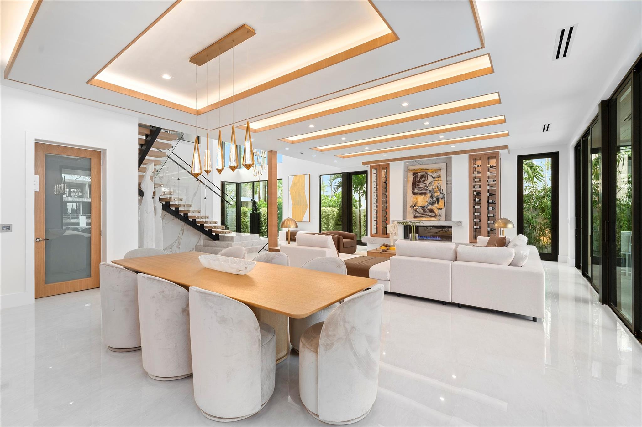 Surrounded by large windows, this elegant space is filled with natural light and offers panoramic scenes of the waterway and lush tropical landscape.