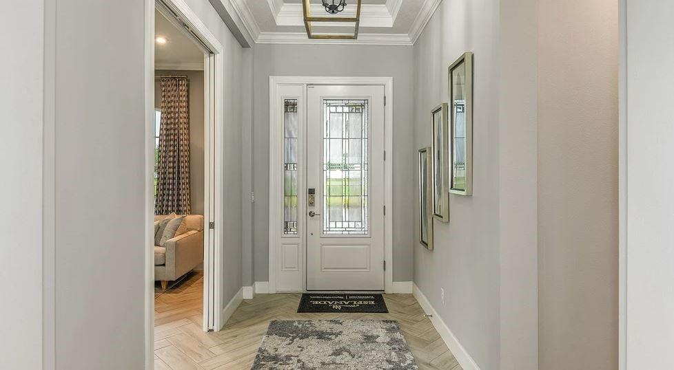 Additional highlights include: tray ceilings, additional bedroom with bathroom, pocket sliding glass door to outdoor living, study, rough-in plumbing for future outdoor kitch