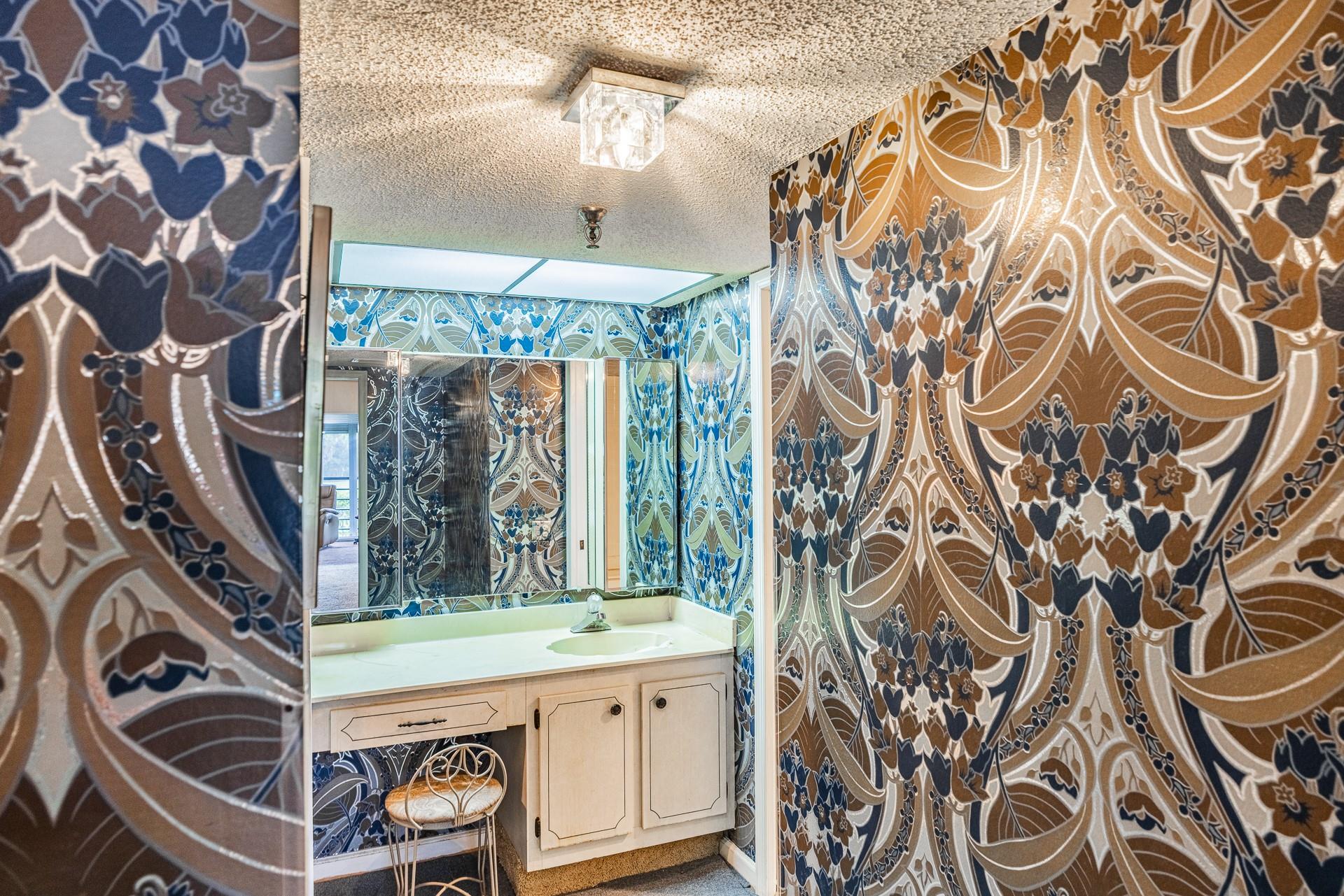 Master bathroom with unique wallpaper