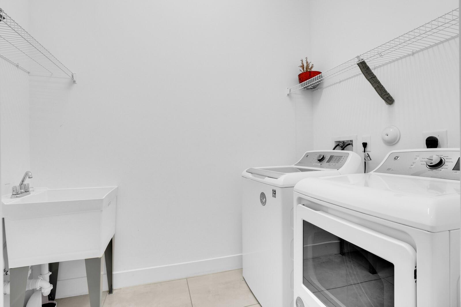 Photo for 9647 Brook Isles Avenue, Delray Beach, FL 33446 - Listing #FX-10513835 LAUNDRY ROOM UNDER AC WITH WASH SINK AND STORAGE