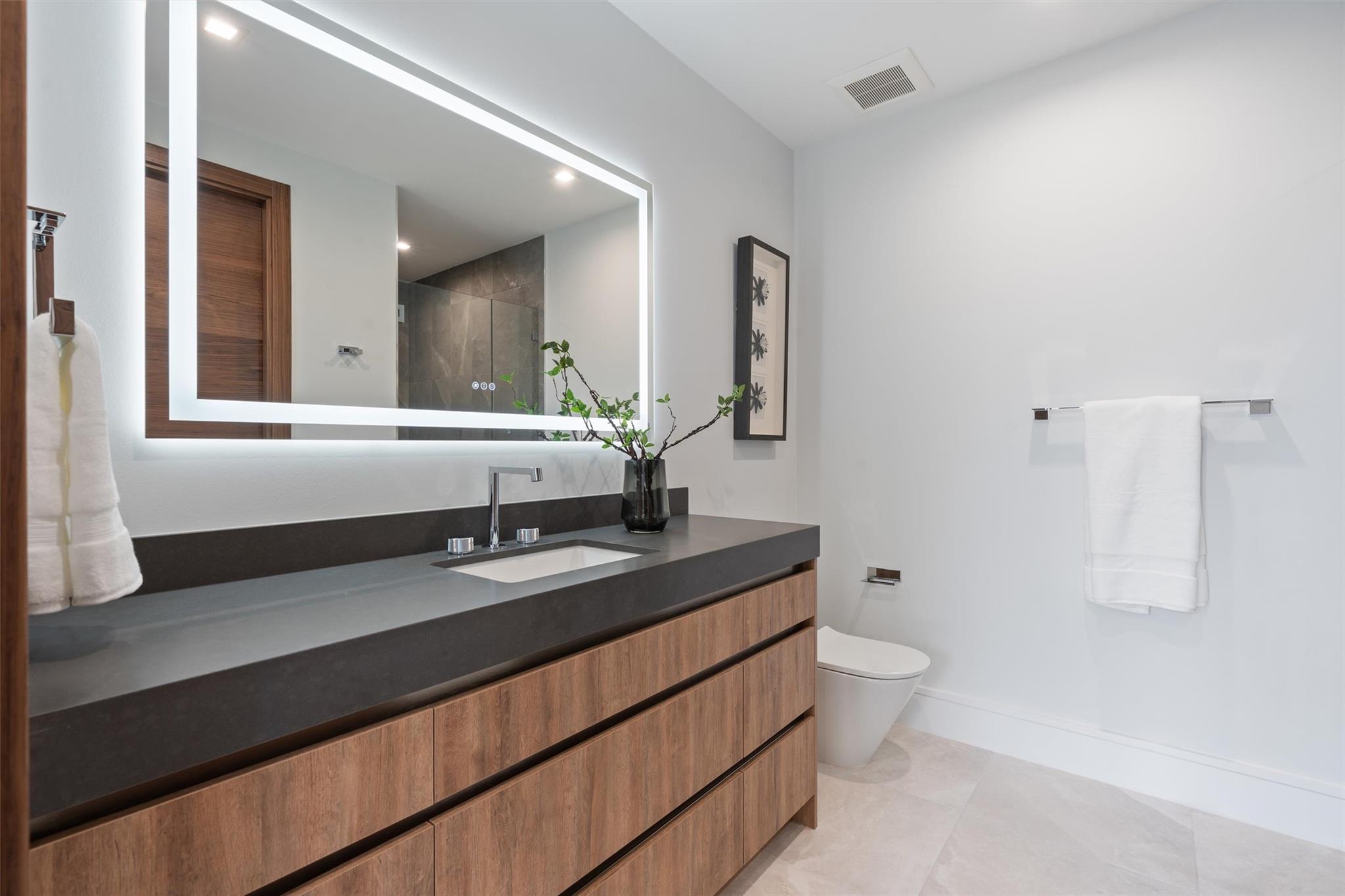 Second floor bathroom with shower and closet.