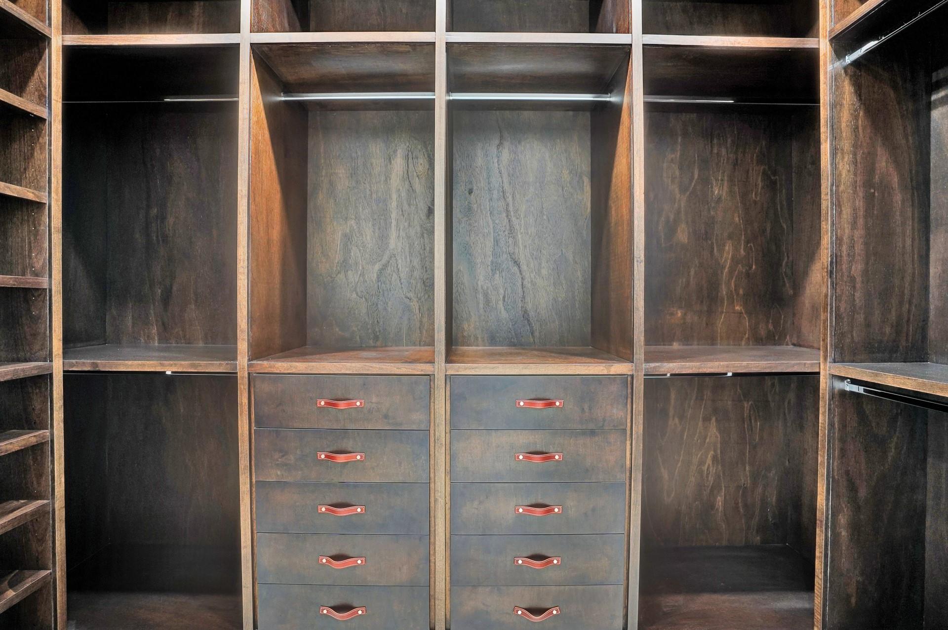 The primary suite boasts separate his-and-hers bathrooms; his bathroom includes a stylish vanity and a large walk-in closet.