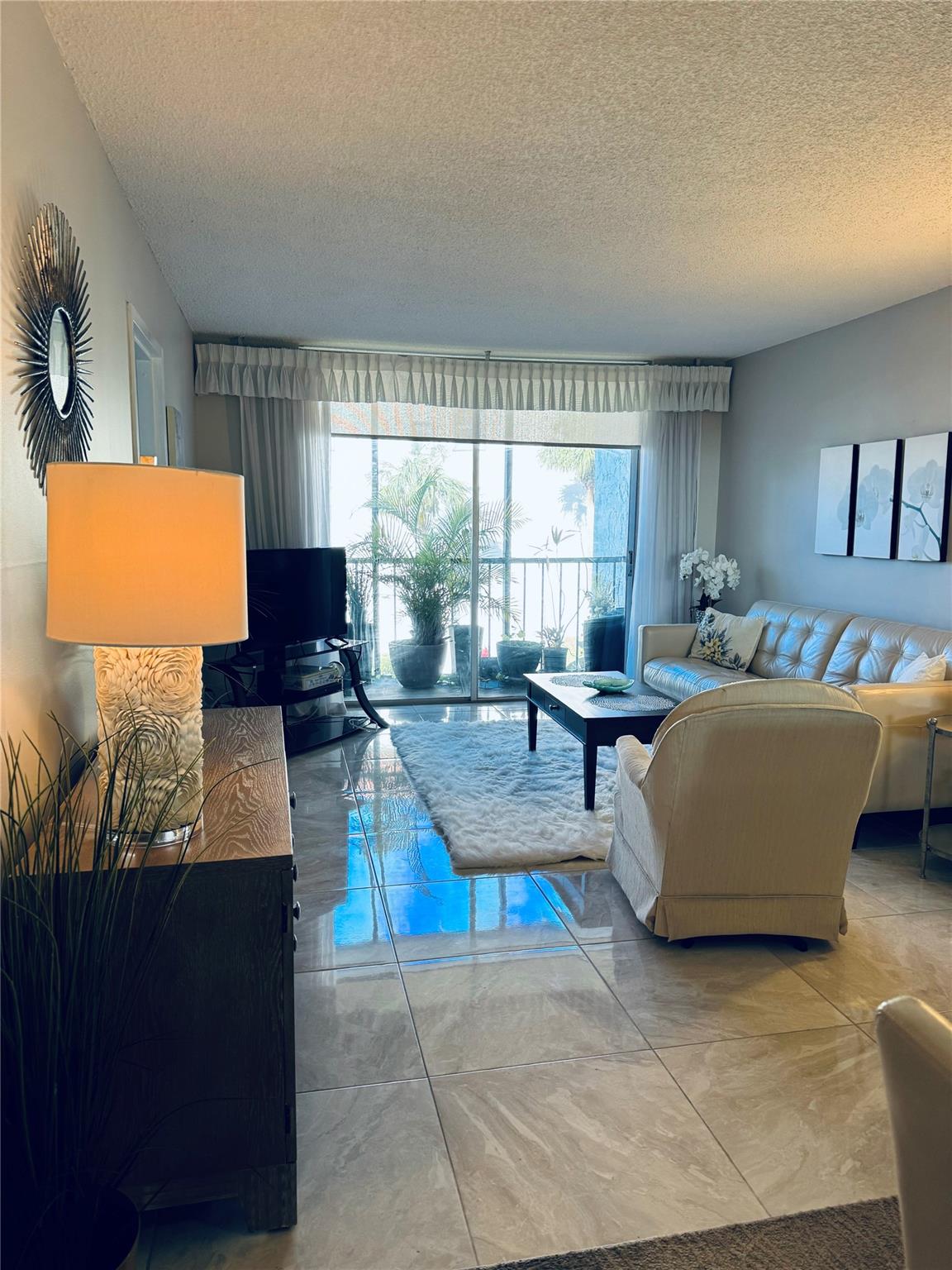 Lovely living area as seen from entry, by kitchen