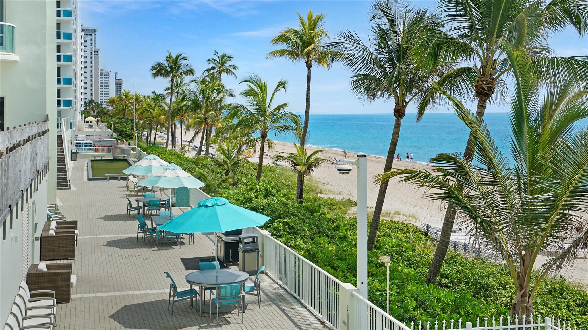 The lower beach deck has bbq grills and plenty of seating. You can see the bocce court here.