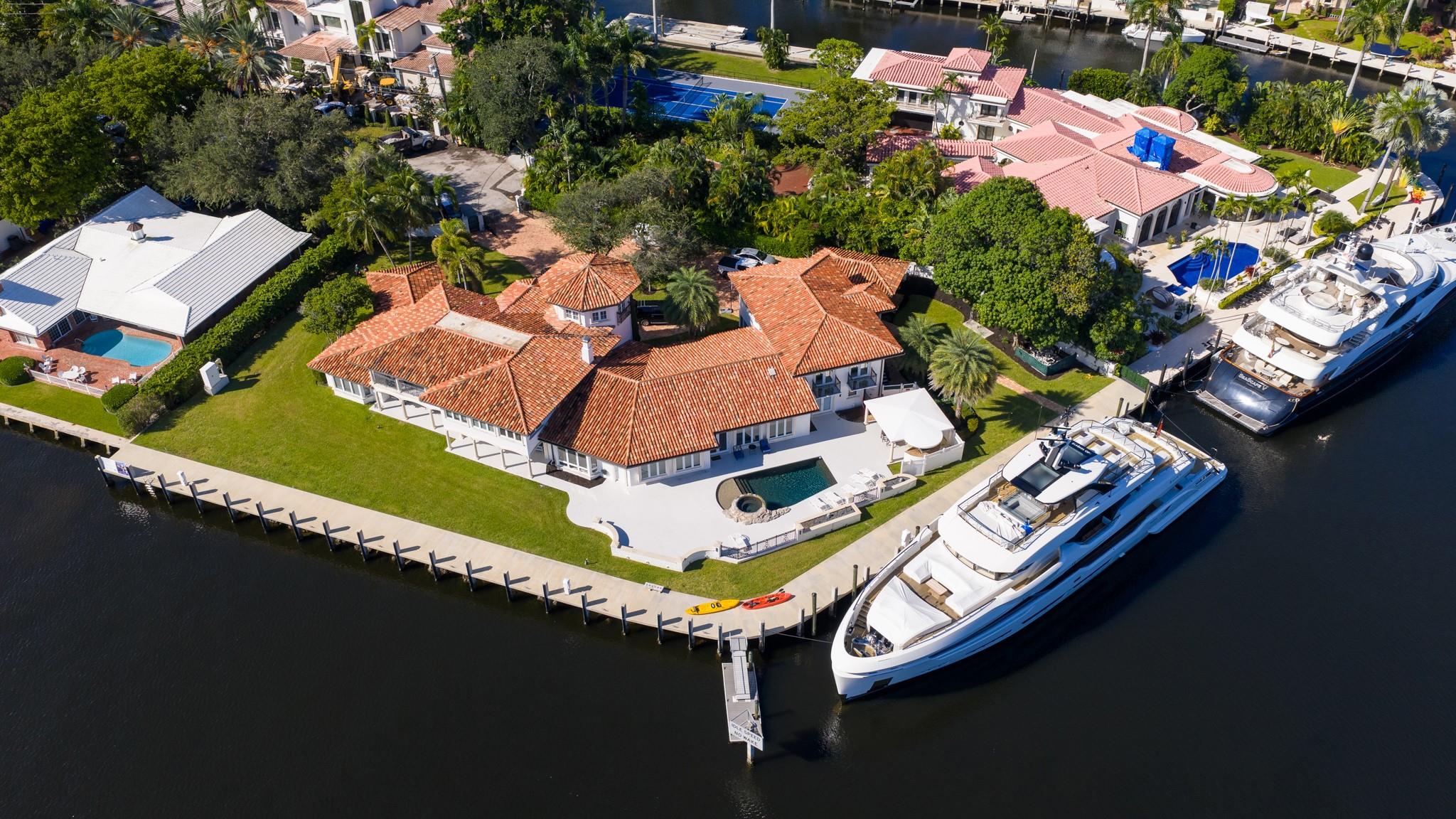 Expansive point-lot estate with 315 feet of waterfront, skyline views, and mega-yacht dockage along Fort Lauderdale’s premier waterways.
