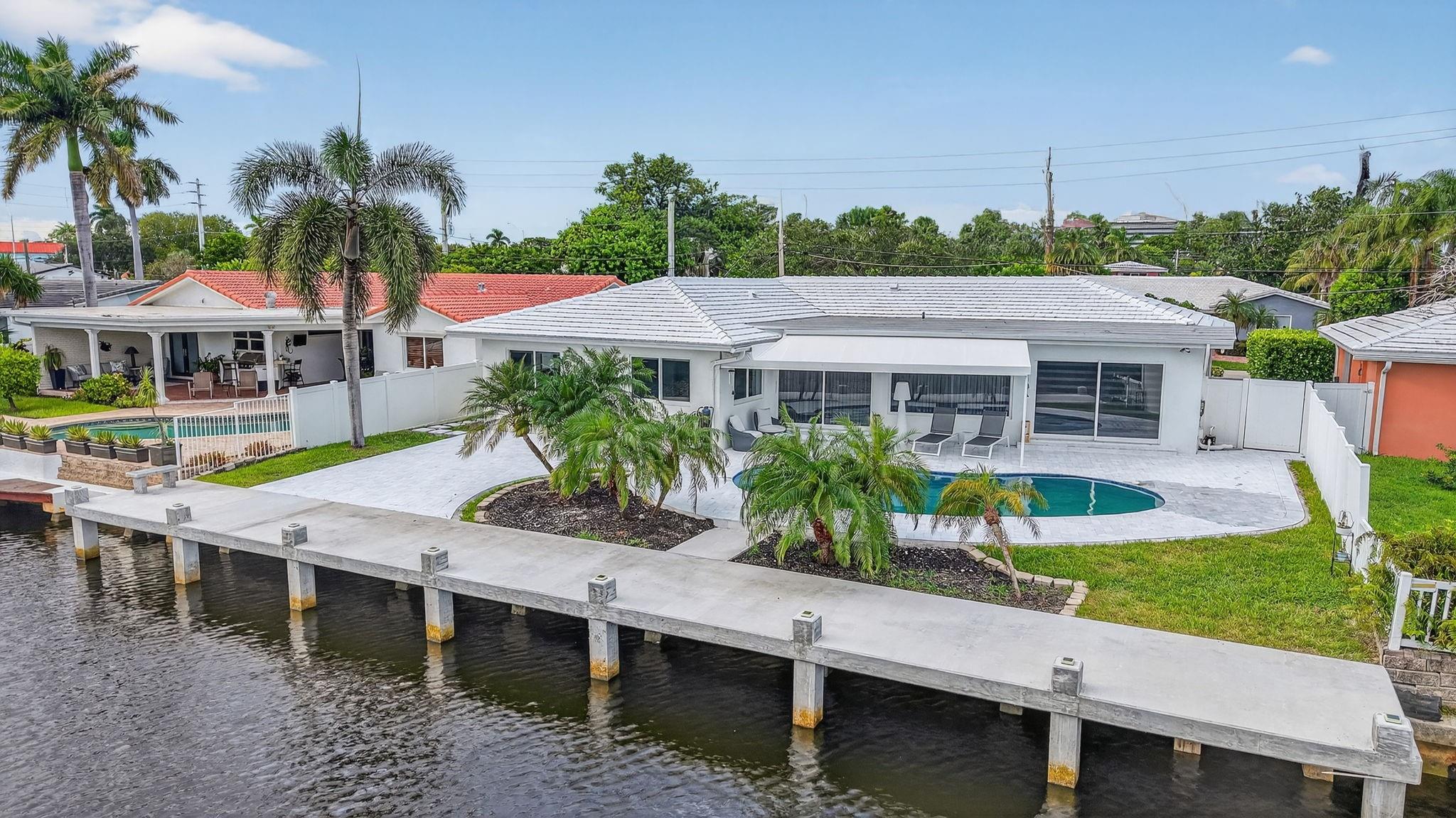 Photo for 2720 NE 59th Street, Fort Lauderdale, FL 33308 - listing #FX-10530969 Nestled in Fort Lauderdale’s prestigious Lake Estates neighborhood, this home is perfect for the boating enthusiast! With a brand-new pool, marble pool deck, concrete seawall with 75-foot dock offering ocean access (with 1 fixed bridge).