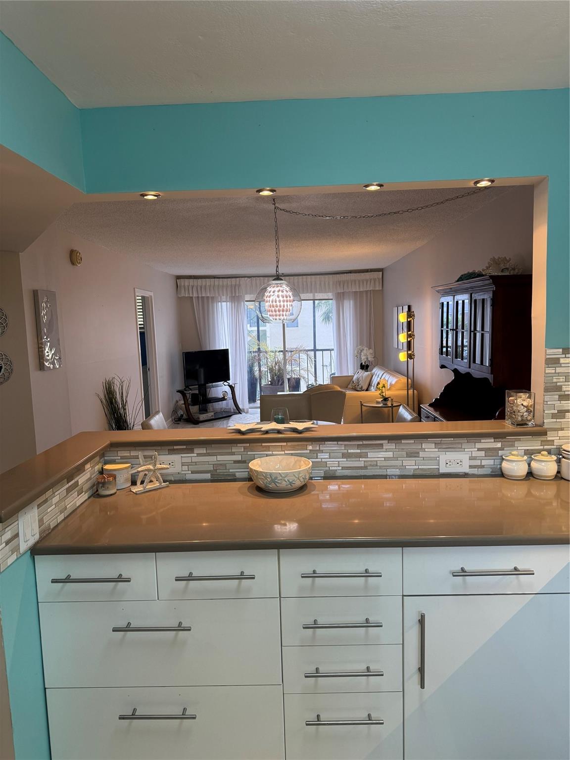 Open kitchen with under cabinet lighting and thoughtful details.