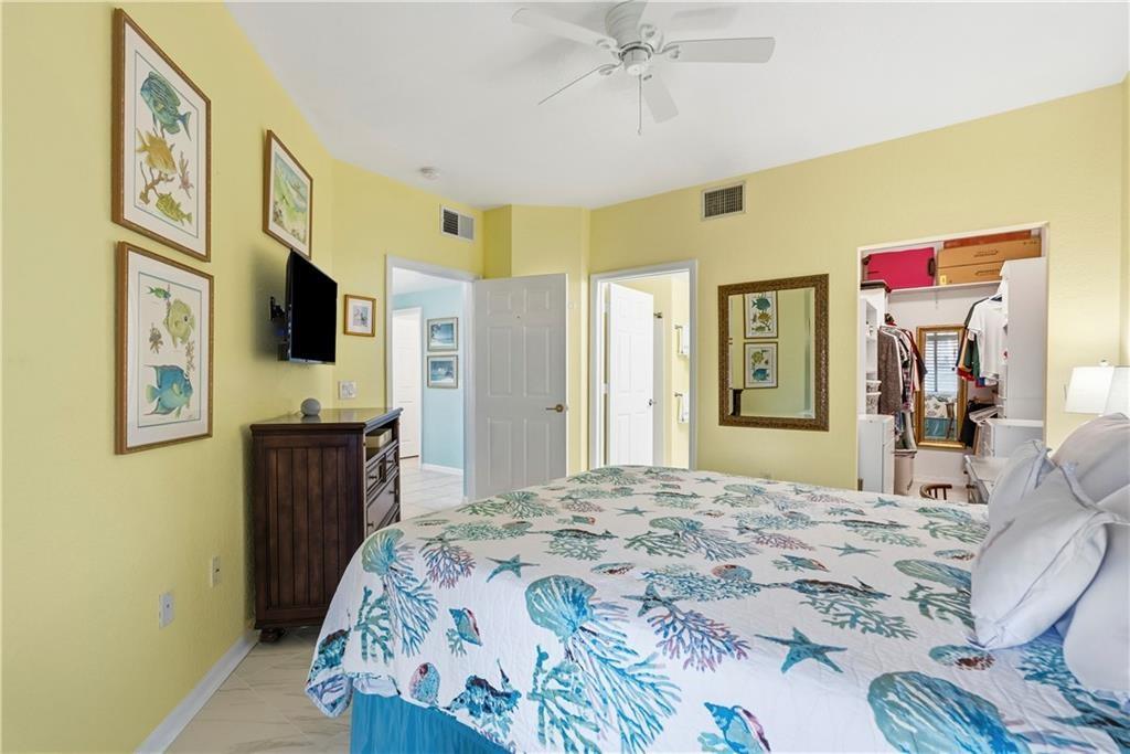 Bedroom with en suite bath, custom cabinet closets and access to main hallway and secondary building