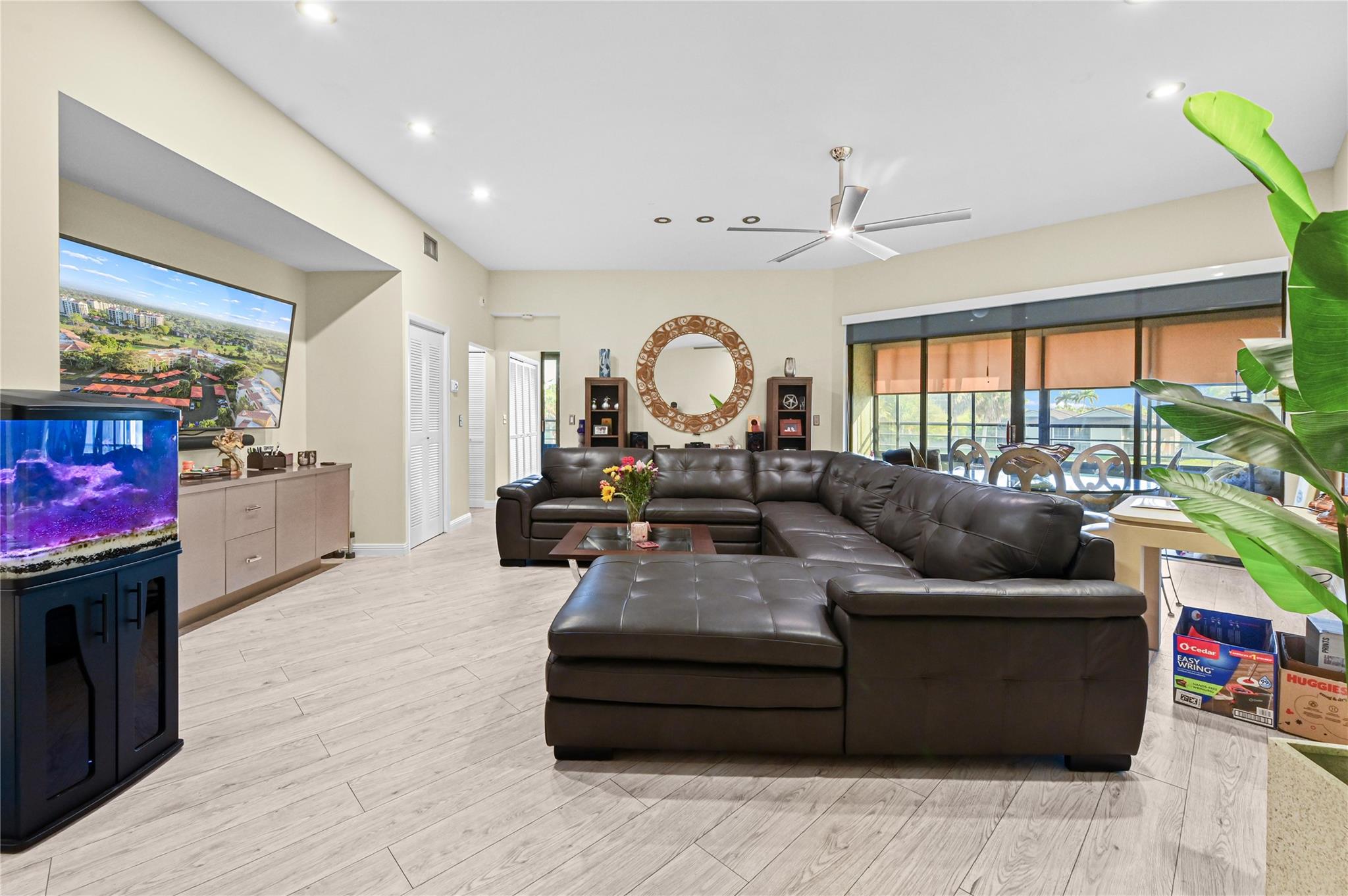 Spacious living room with high soaring ceilings and recessed lighting