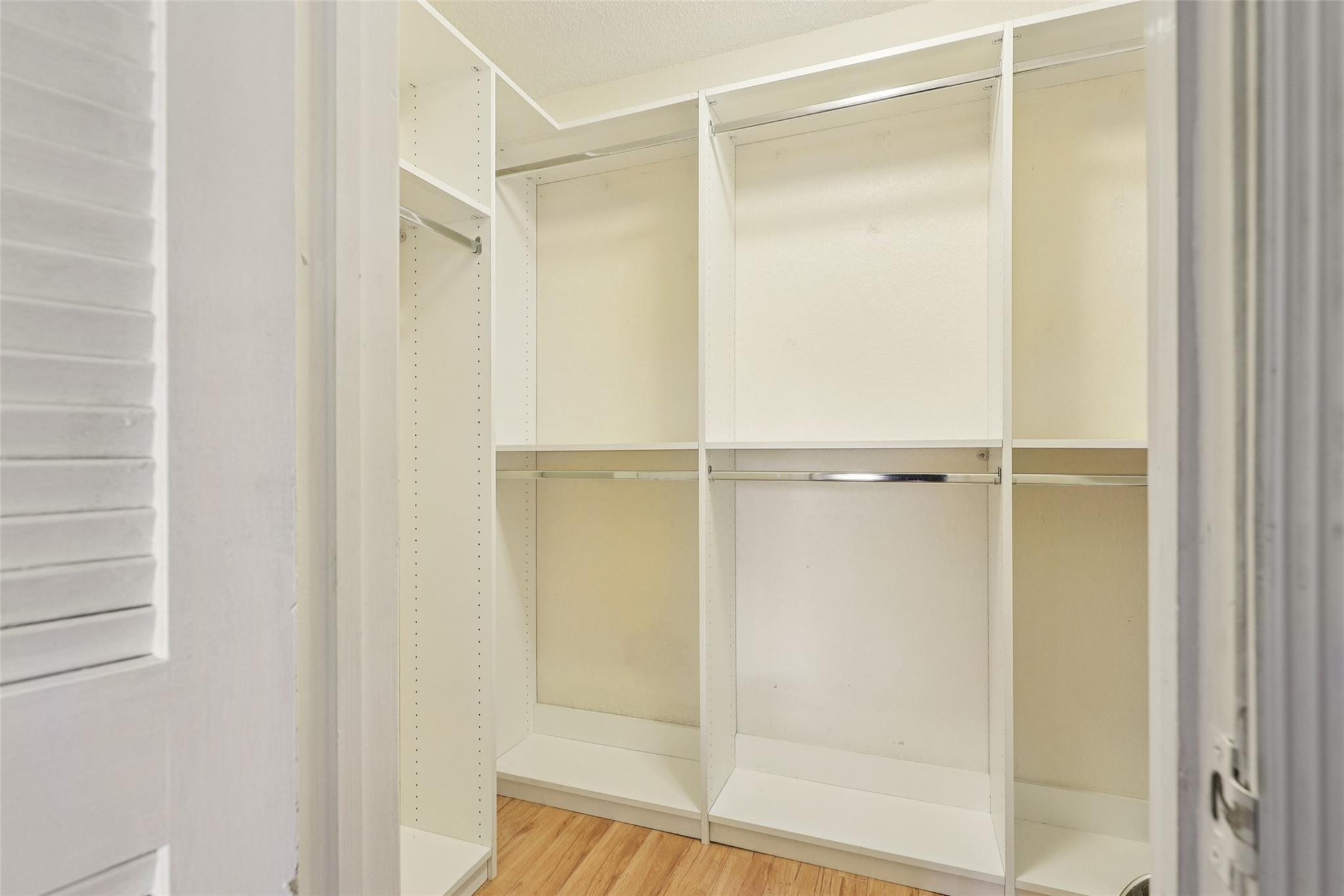 Large walk-in closet included in guest bedroom.