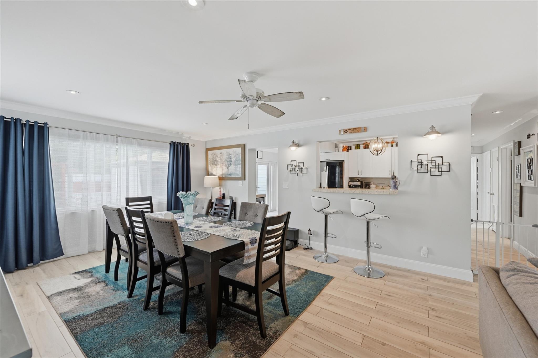 Separate dinning area just off the kitchen. The big window allows in lots of natural light. You even have a pass through from the kitchen.