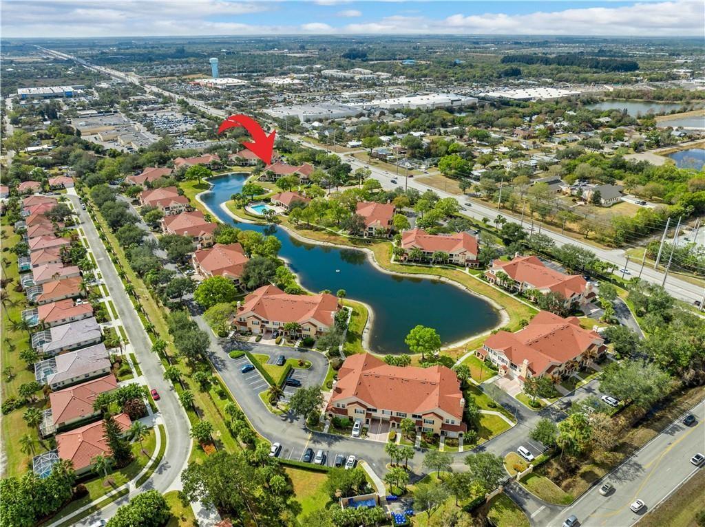 Aerial overview of property's location featuring nearby suburban area and a large body of water