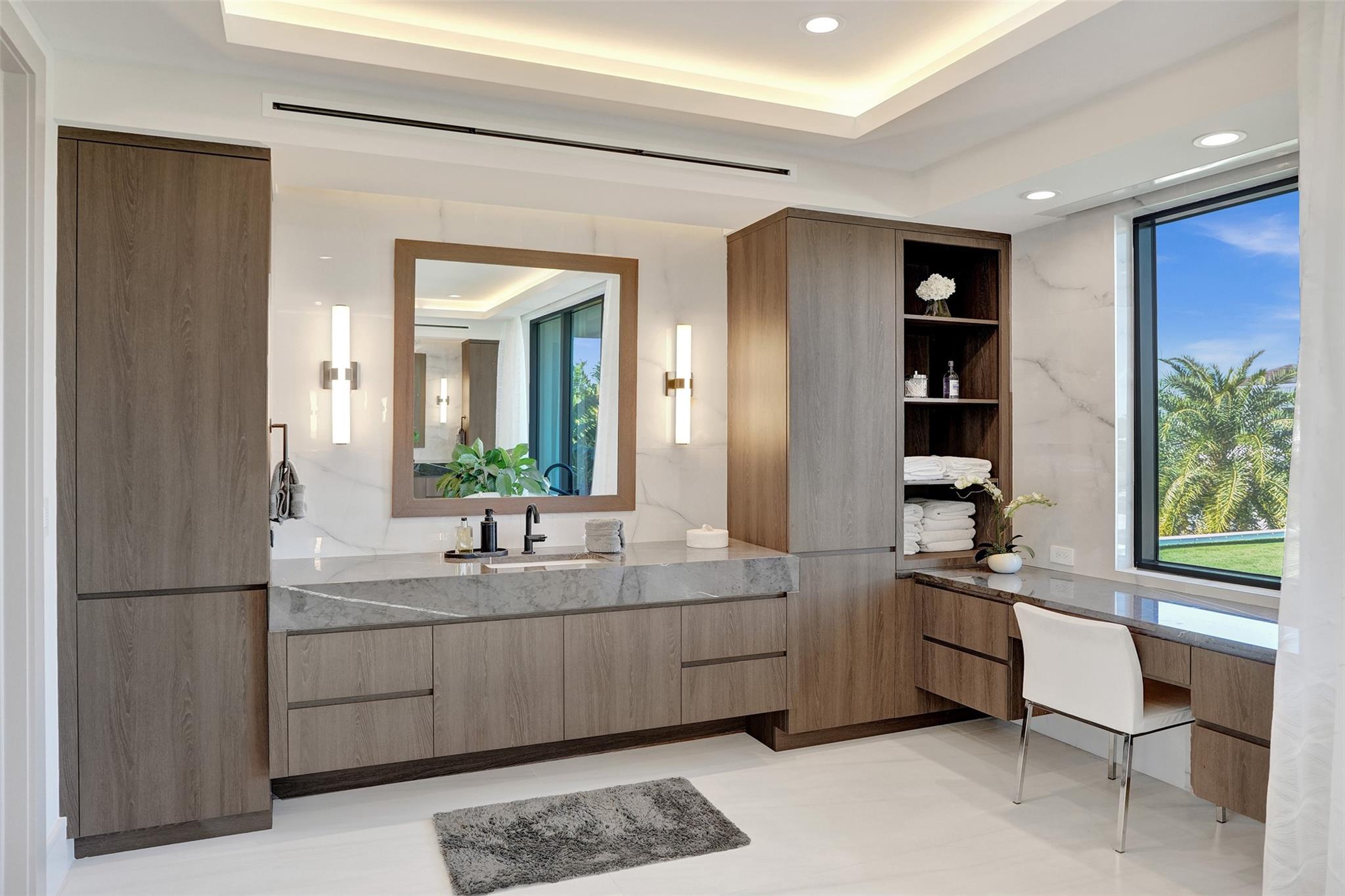 Master bath-her vanity with adjoining makeup desk