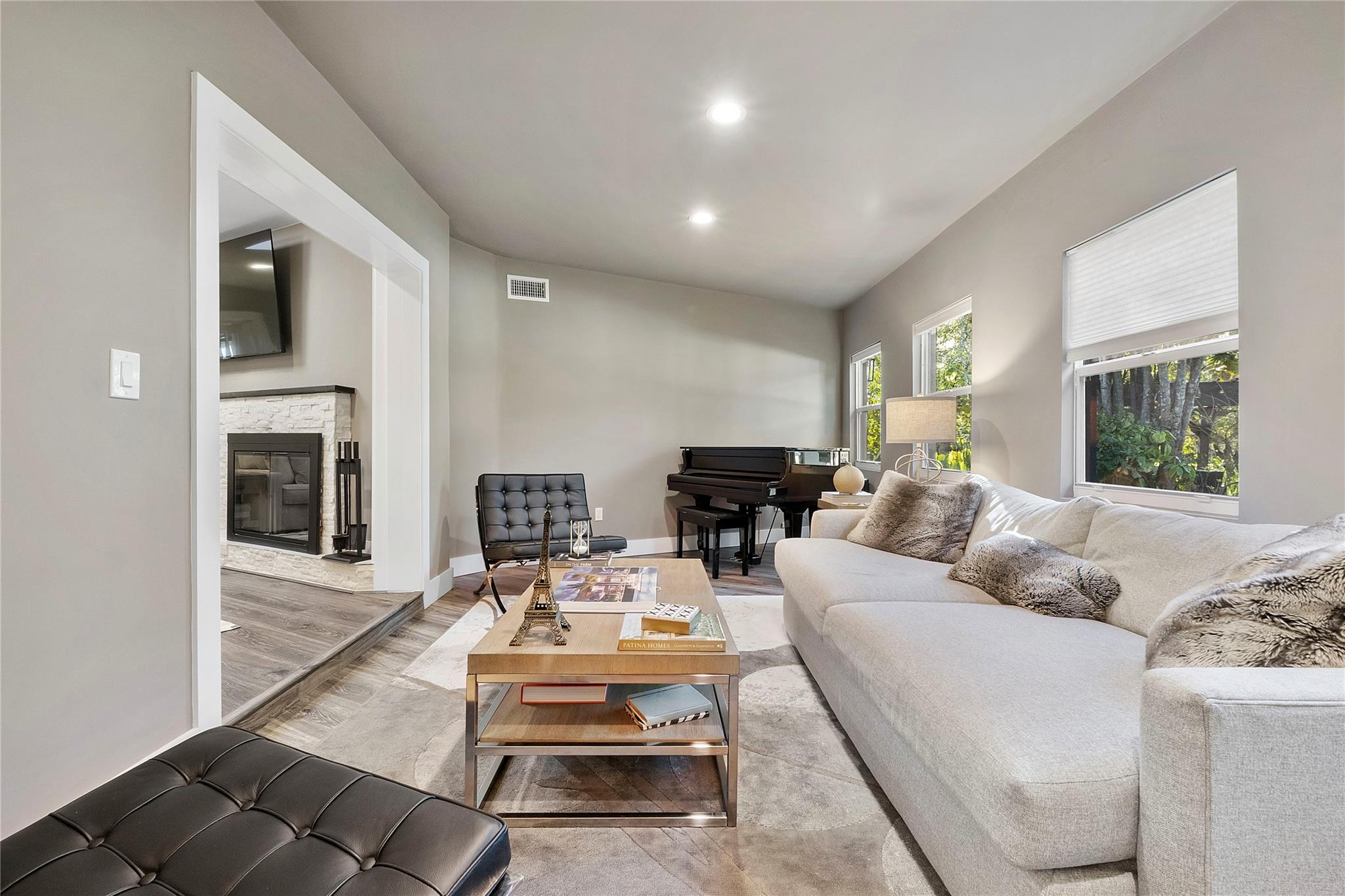 This is not just one of the many living rooms, The sellers call this room their 'Piano room" because they have a beautiful piano in this pretty room and they use this room as the music flows thought the house and its open floor plan from this situated piano area,