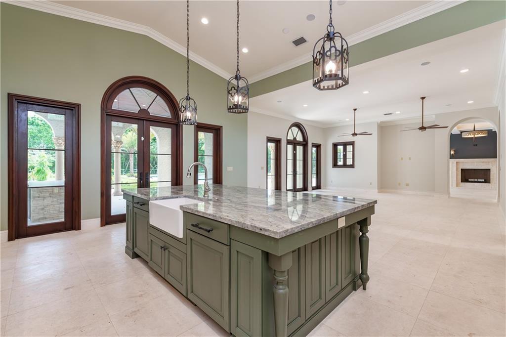 GOURMET KITCHEN AND VIEW OF FAMILY ROOM