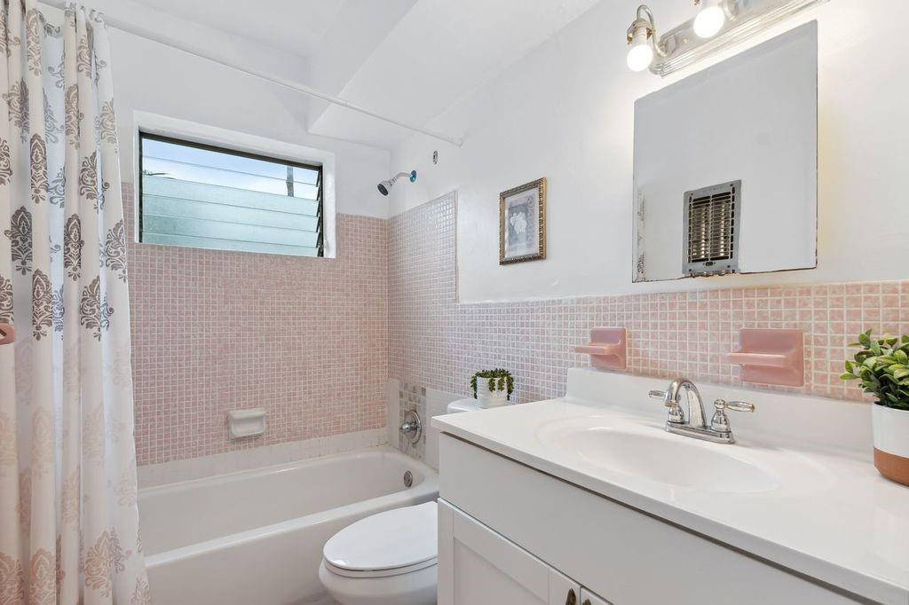 tiled bath/shower and newer vanity