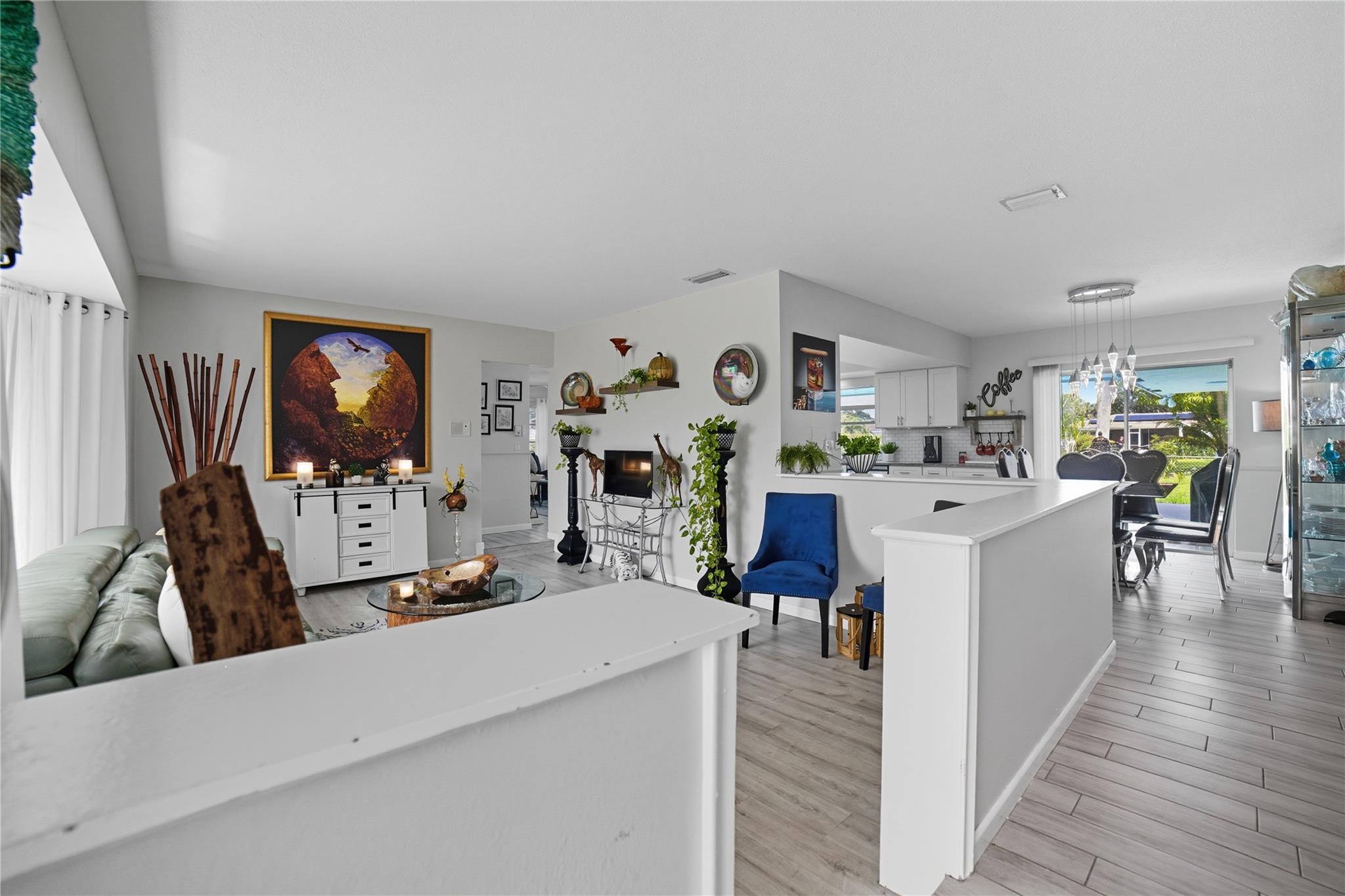 Entry, living area, dining area, kitchen views-open floor plan.