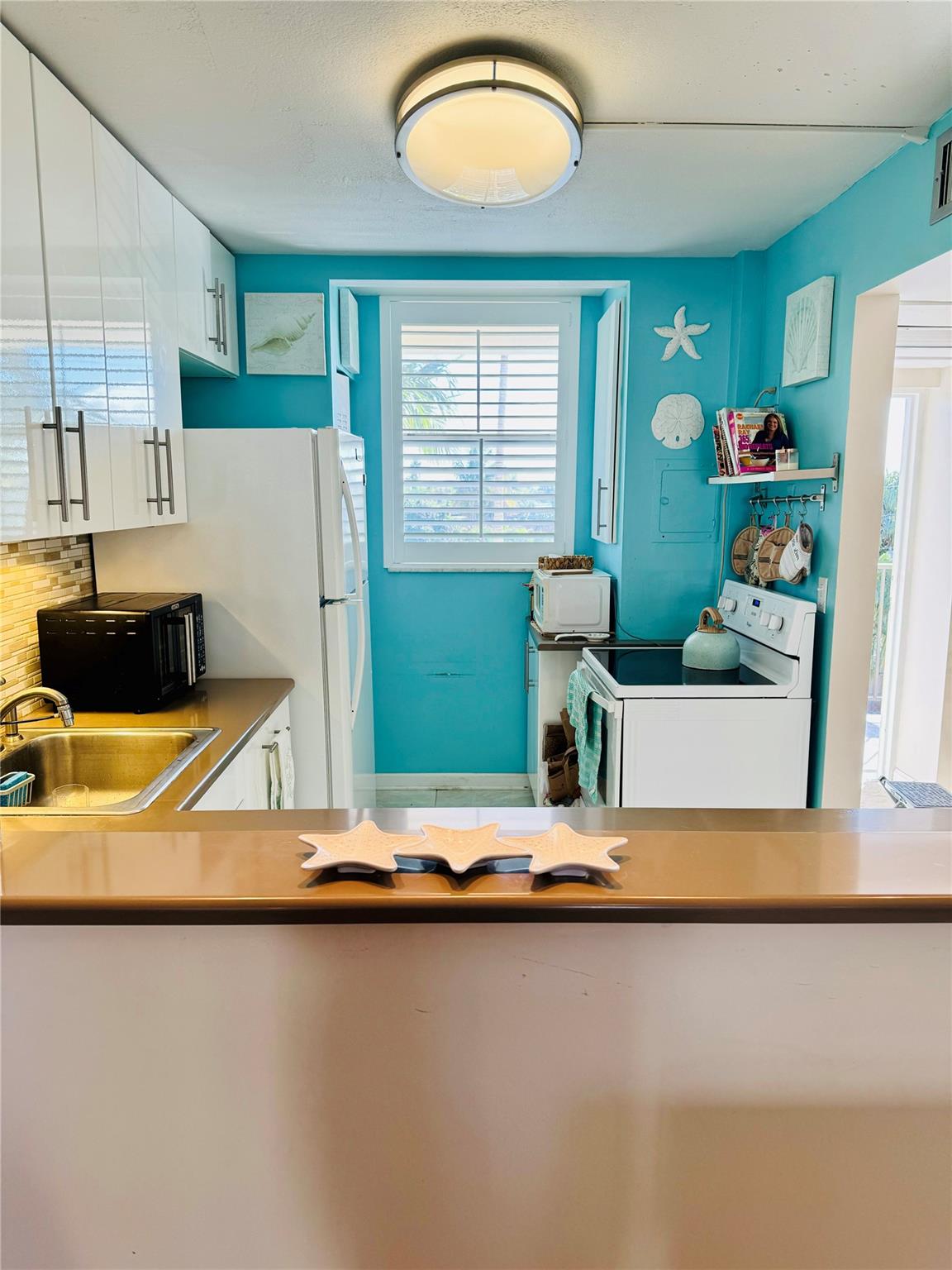 View of kitchen from dining room