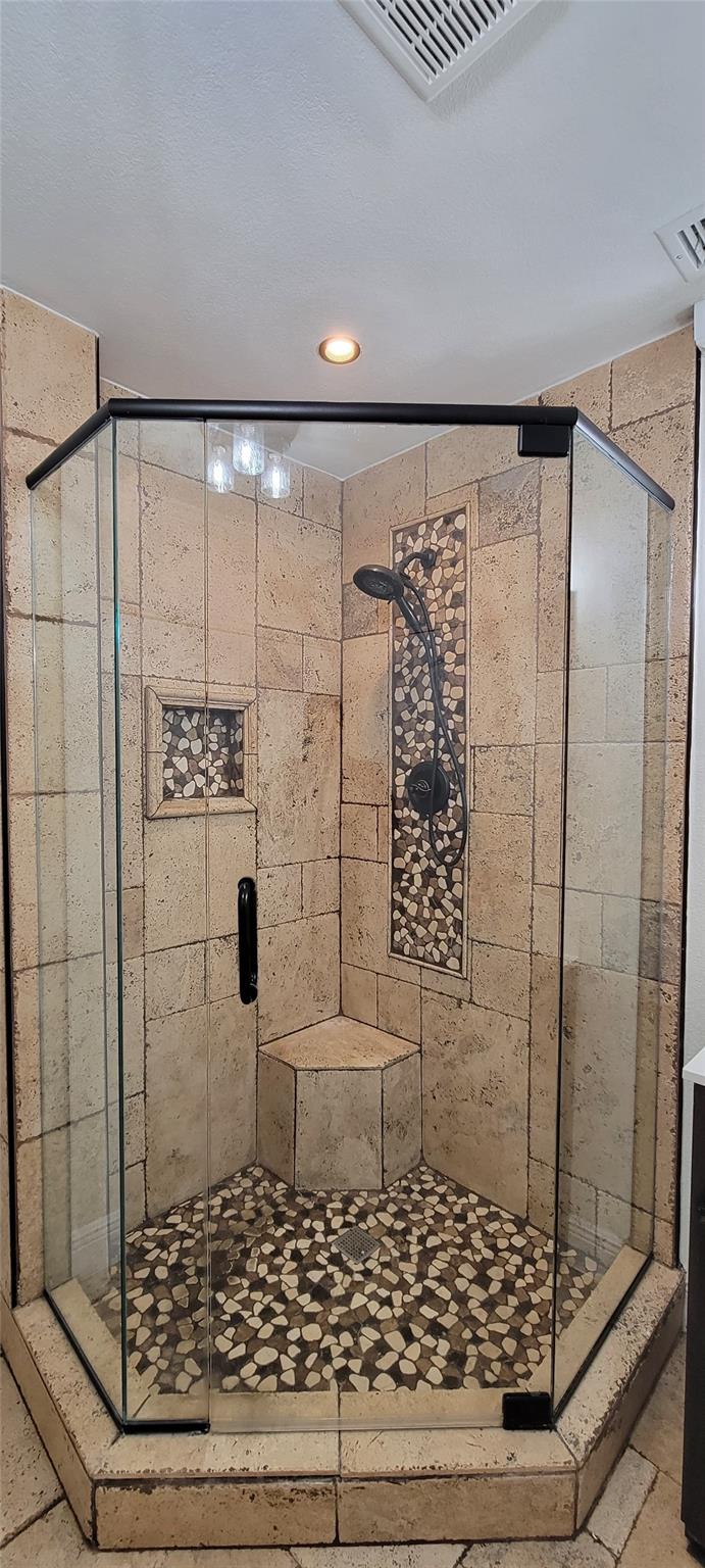 Updated bathroom featuring modern fixtures and finishes