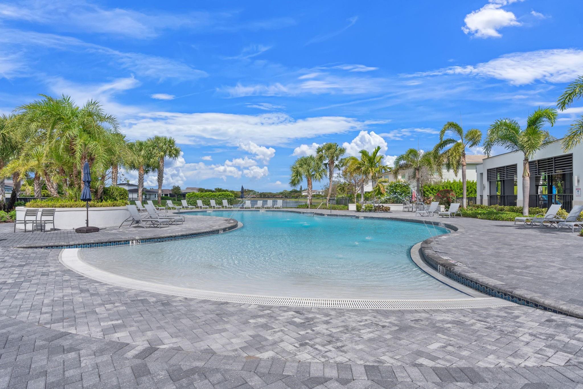 Large Shallow End with Water Spouts Make a Day at the Pool Fun for the Whole Family.