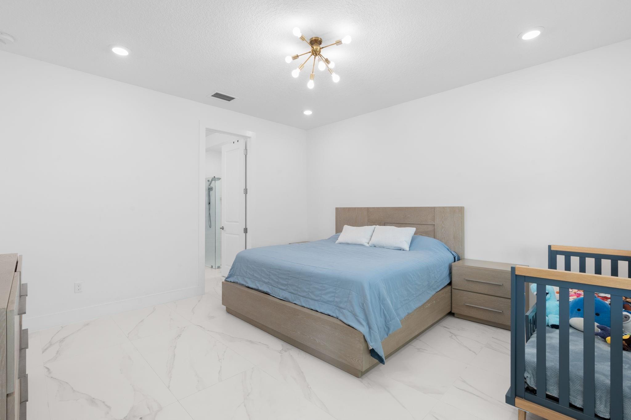 Primary Bedroom with Continuous Flooring Throughout the First Floor