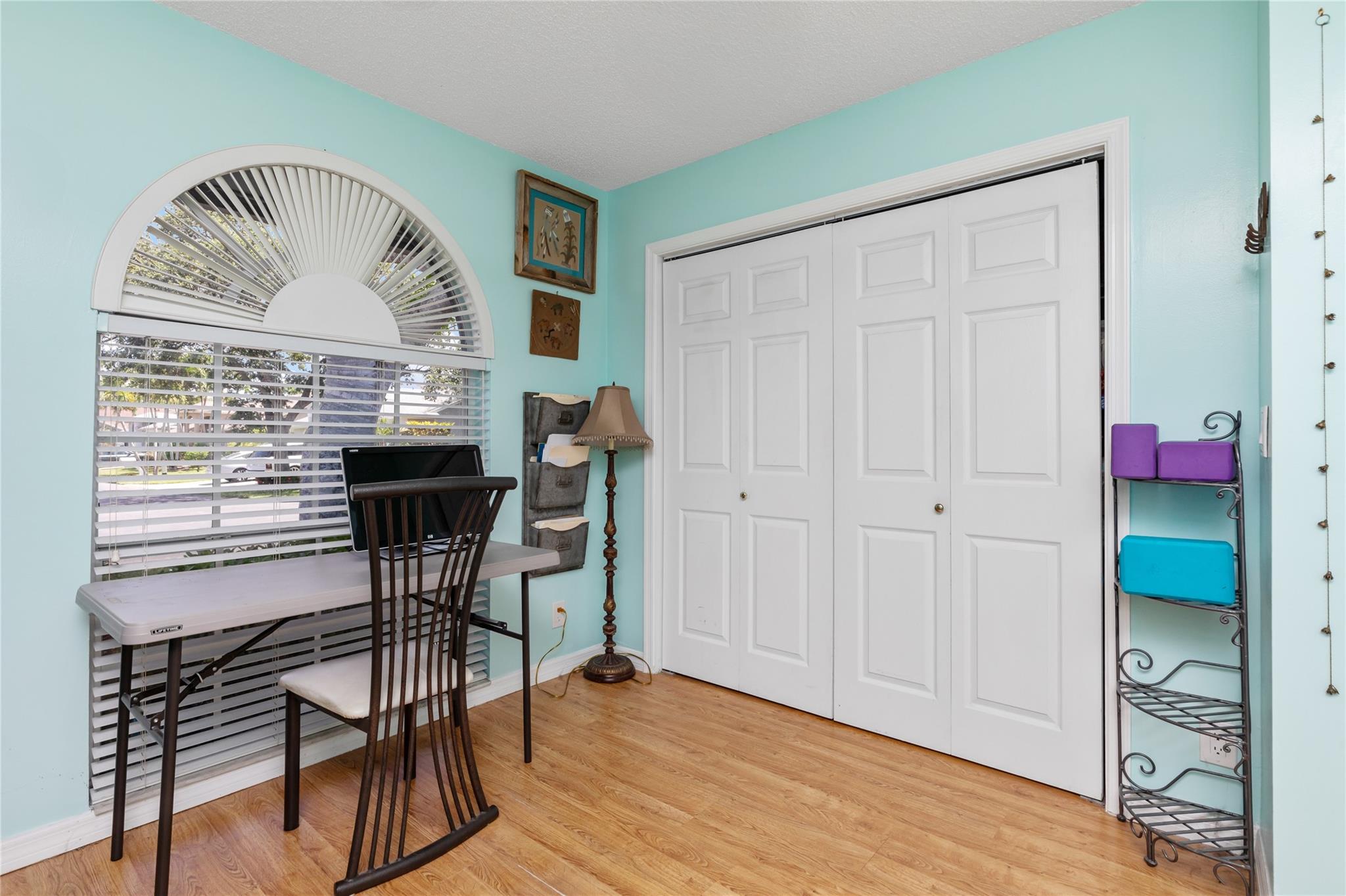 Spacious 3rd guest bedroom with arched window