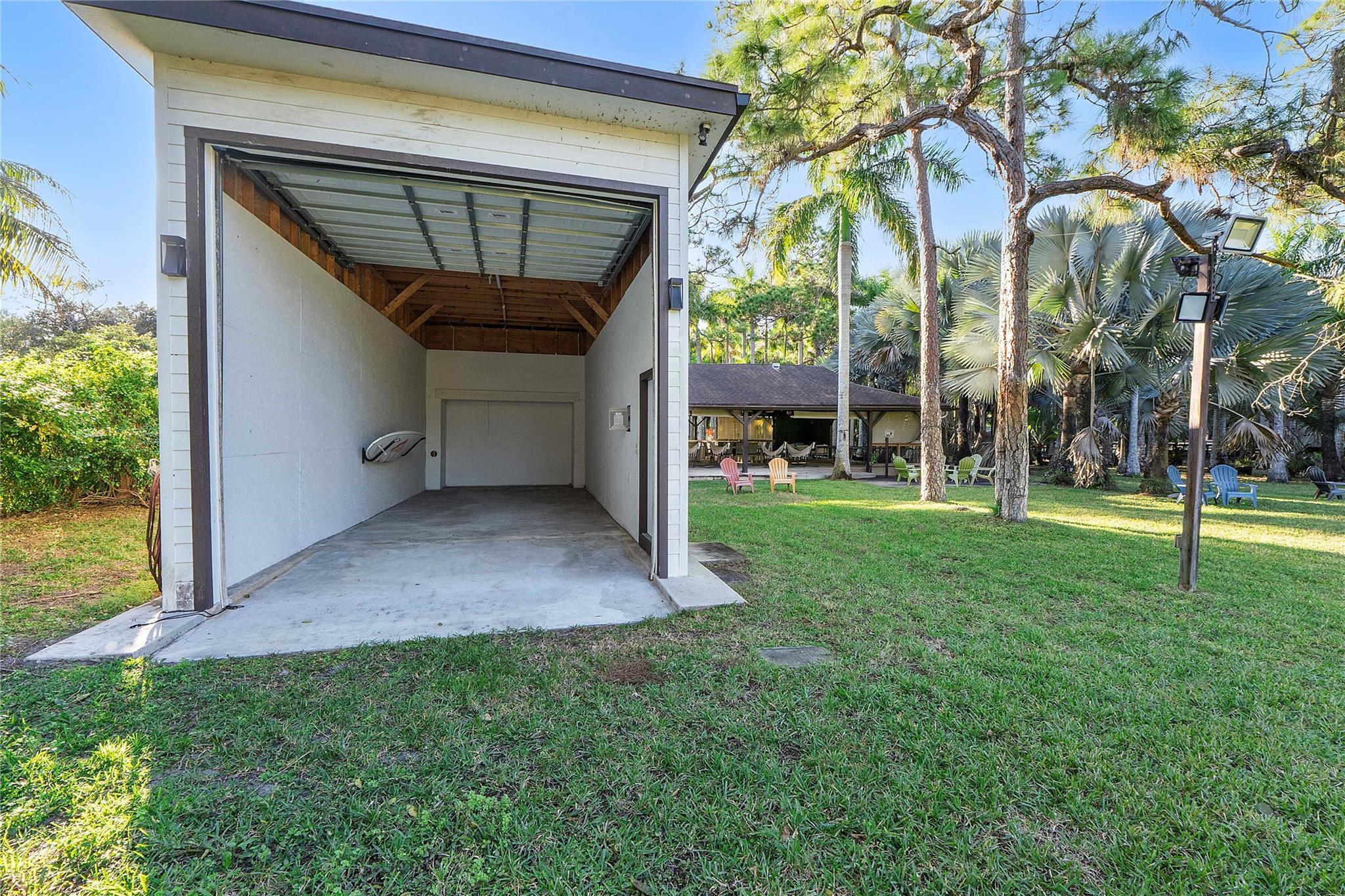 The back garden has a huge RV hanger with full electrical& plumbing facilites, or you could turn it into a barn,