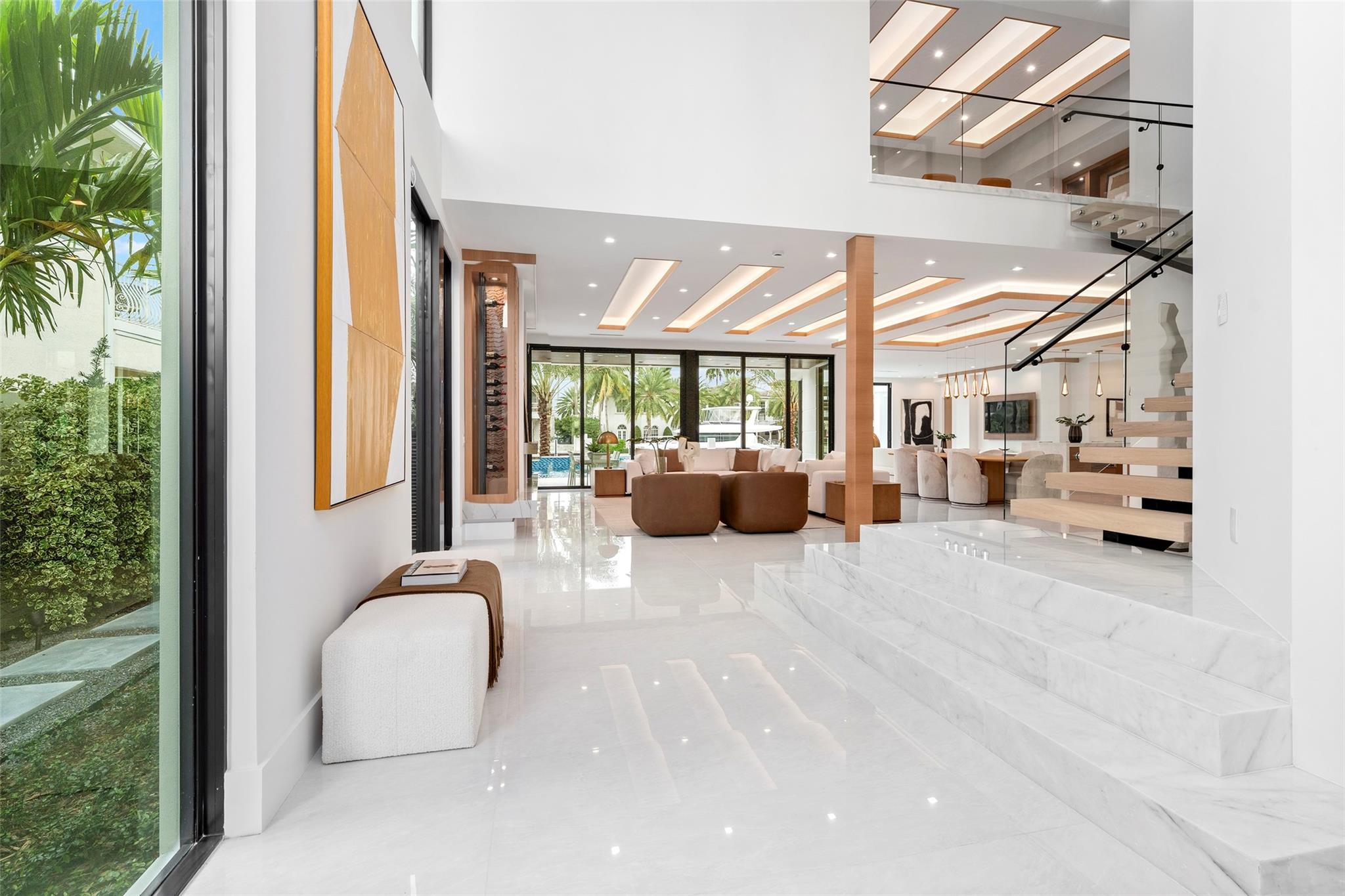 Step inside to be greeted by a grand foyer with soaring ceilings and a stunning chandelier, setting the tone for elegance throughout the home.
