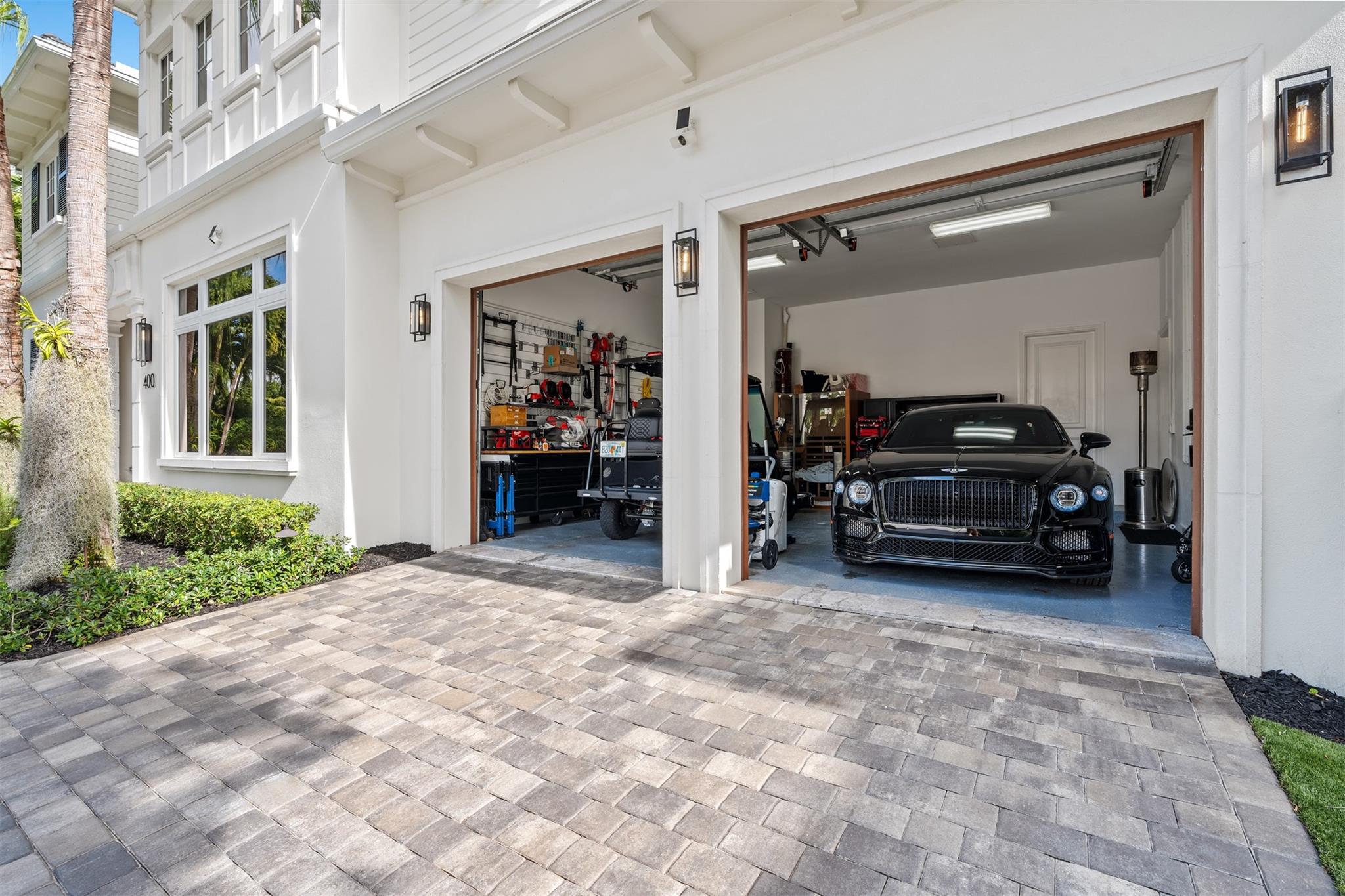 3 car garage with ample room for vehicle lifts and 6 cars.