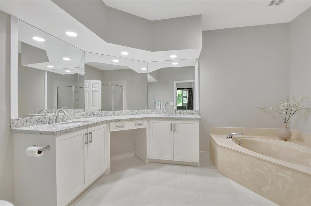 Photo for 5801 Coach House Circle, Unit E, Boca Raton, FL 33486 - Listing #FX-10436780 Big primary bath features double, undermount sinks, granite counter and a make-up station.