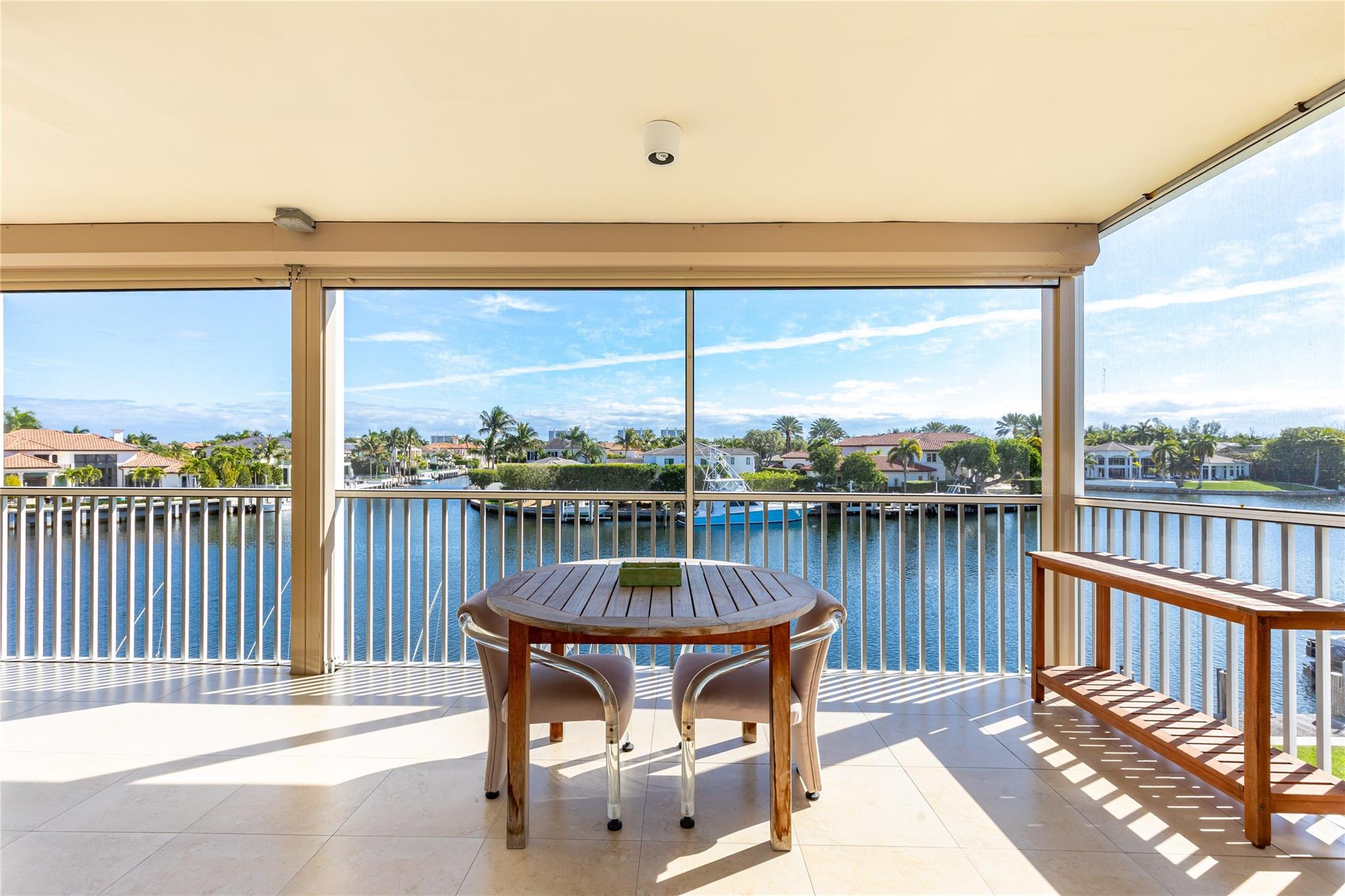 Expansive balcony with east views overlooking Royal Palm Estates. Entry to balcony from both living and primary bedroom.