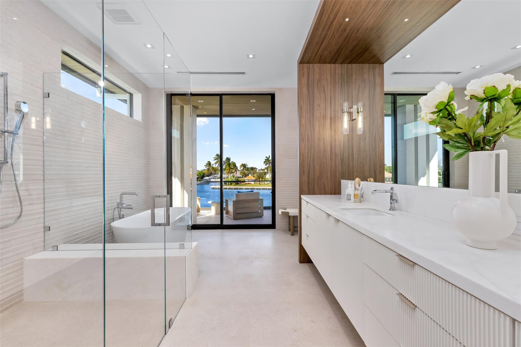 Primary Bedroom has two bathrooms each equipped with their own vanity, shower and closet.