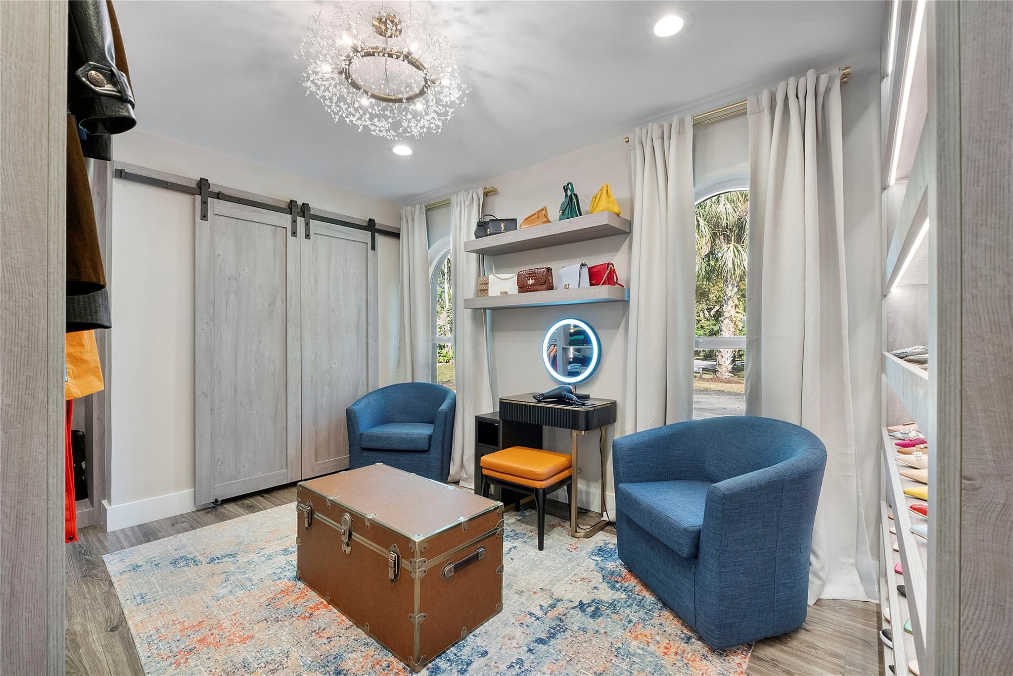 This elegant designer bedroom has Italian designer custom closets for fashion designer purses & shoes,