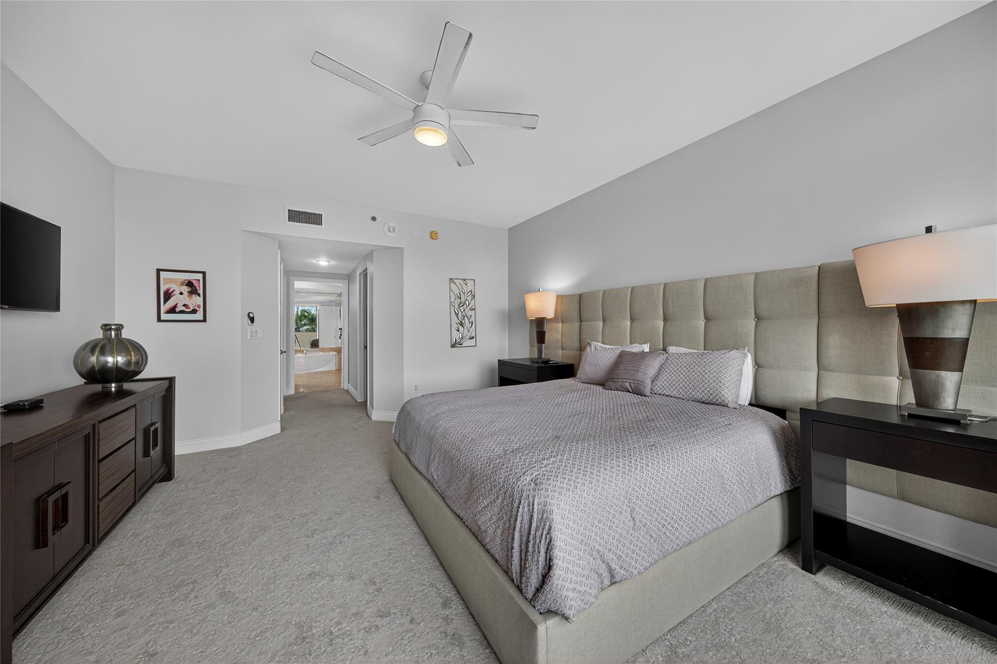 Large primary bedroom with ceiling fan