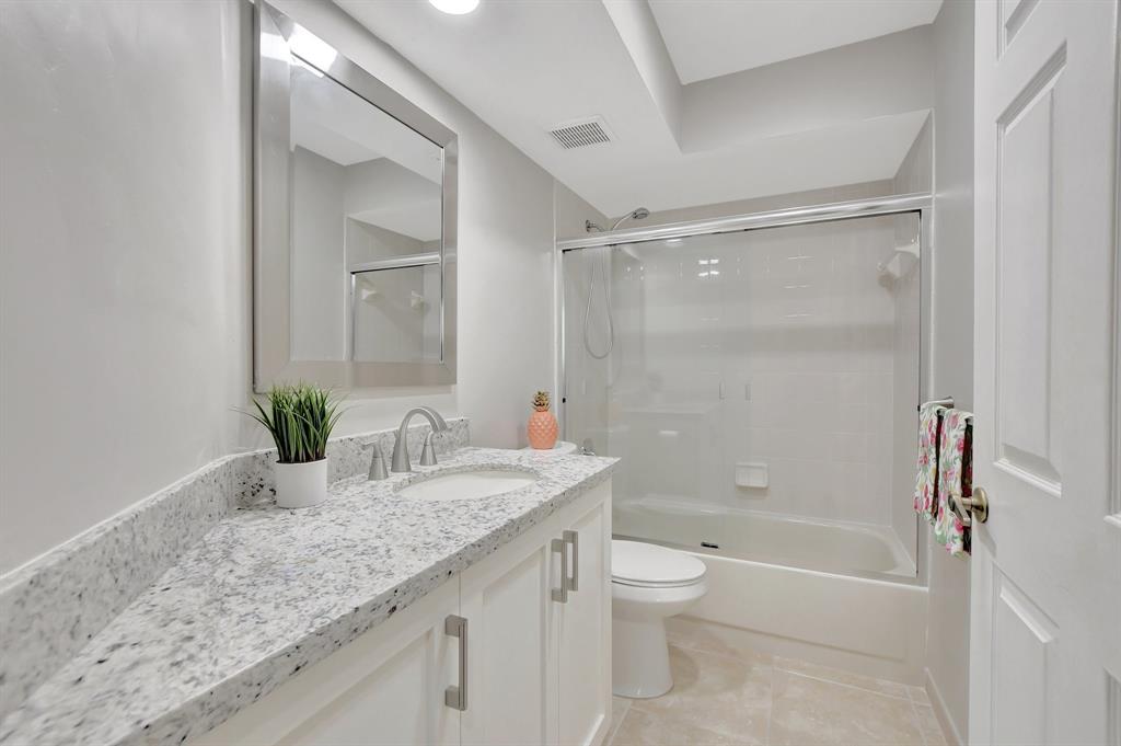 Photo for 5801 Coach House Circle, Unit E, Boca Raton, FL 33486 - Listing #FX-10436780 Beautiful guest bath features updated vanity with undermount sink and granite countertop.